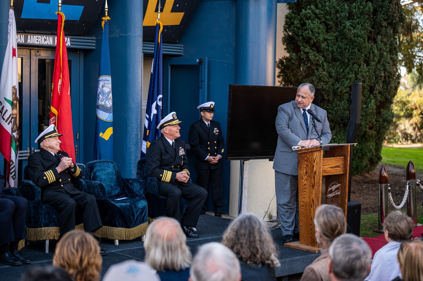 SAN DIEGO (Jan. 20, 2023) — Secretary of the Navy Carlos Del Toro delivers remarks during a ceremony awarding retired U.S. Navy Capt. E. Royce Williams, left, with a Navy Cross Jan. 20. Del Toro was in San Diego for various fleet engagements, awards ceremonies and ship events