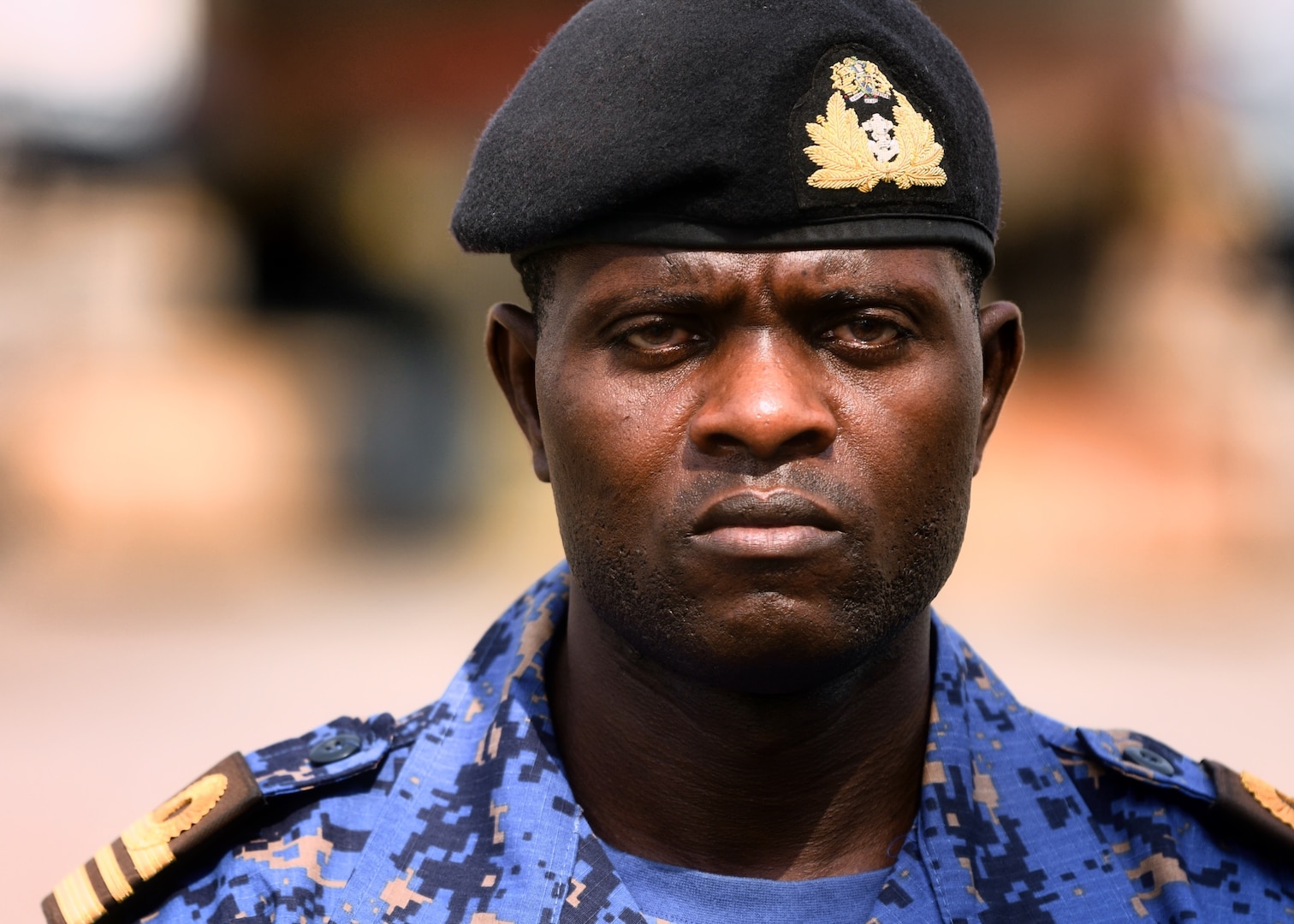 The Gambian Navy Lt. Cmdr. Farra Jobe, a liaison officer, poses for a photo in the Naval Dockyard in Lagos, Nigeria, Jan. 23, 2023. Obangame Express 2023, conducted by U.S. Naval Forces Africa, is a maritime exercise designed to improve cooperation, and increase maritime safety and security among participating nations in the Gulf of Guinea and Southern Atlantic Ocean. U.S. Sixth Fleet, headquartered in Naples, Italy, conducts the full spectrum of joint and naval operations, often in concert with allied and interagency partners, in order to advance U.S. national interests and security and stability in Europe and Africa. (U.S. Navy photo by Mass Communication Specialist 1st class Cameron C. Edy)
