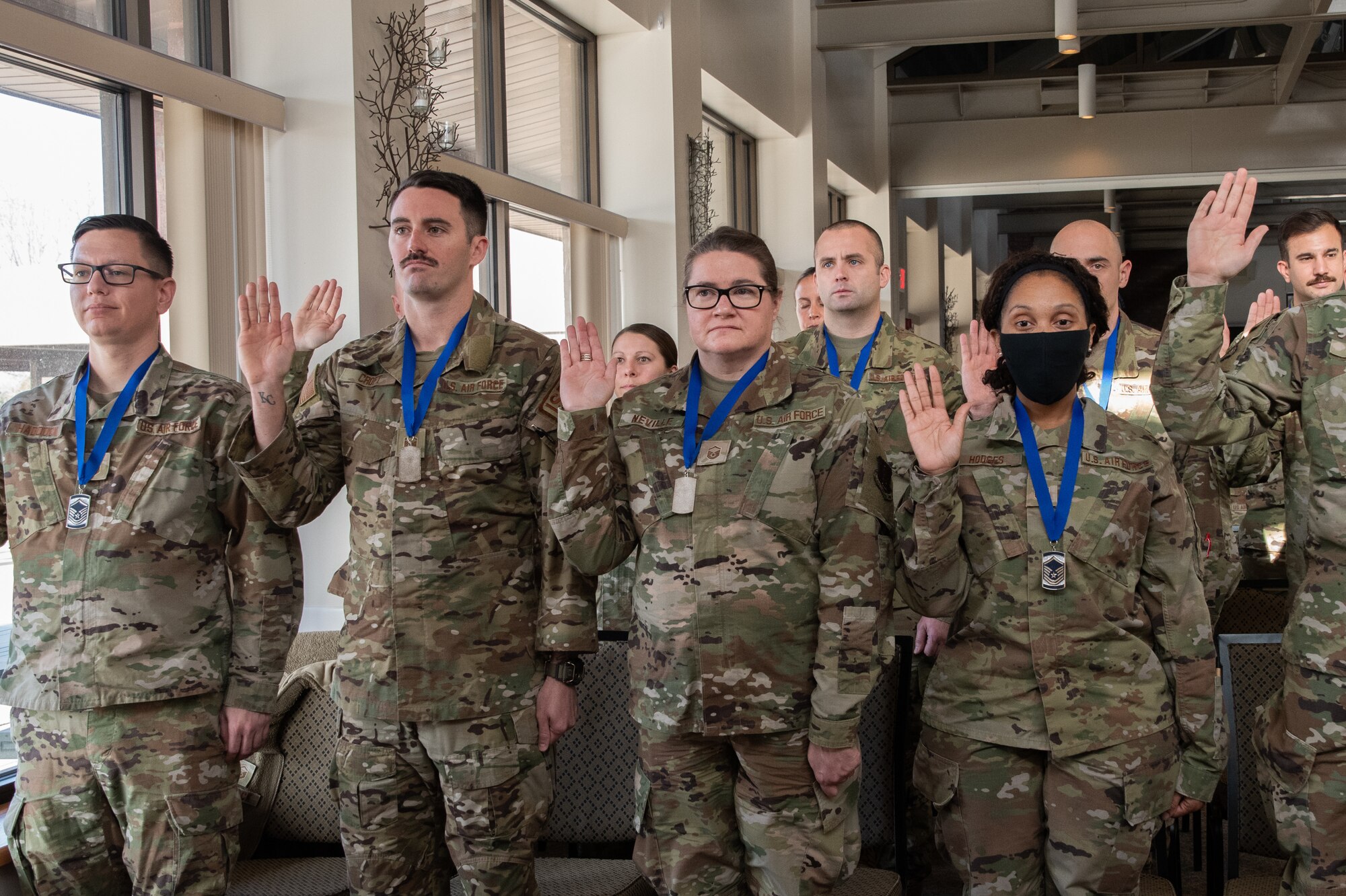 Inductees rise for the senior noncommissioned officer creed during a SNCO induction ceremony at Knob Noster, Missouri, Jan. 8, 2023. Thirteen of the 131st Bomb Wing's newest master sergeants were inducted into the SNCO Corps during the event.   (U.S. Air National Guard photo by Airman 1st Class Phoenix Lietch)