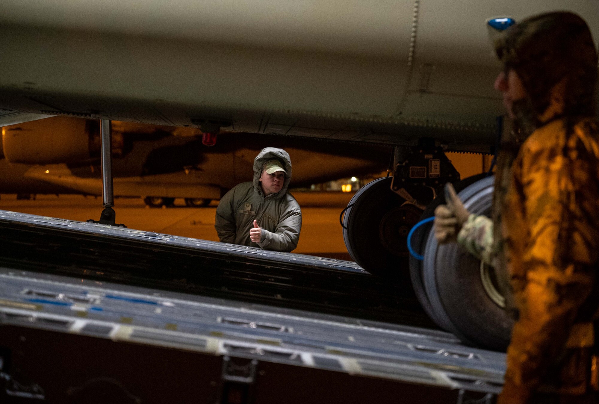 Senior Airman Jaden Martin, 436th Aerial Port Squadron ramp services operator, observes the loading of a CH-47F Chinook helicopter during a foreign military sales mission at Dover Air Force Base, Delaware, Jan. 14, 2023. A C-17 Globemaster III transported the CH-47 to the Spanish army as a part of the Department of Defense’s FMS program. The United States and Spain are committed to upholding peace and security, protecting the planet’s climate for future generations, promoting democracy and human rights, and enhancing economic prosperity around the world. (U.S. Air Force photo by Senior Airman Faith Barron)