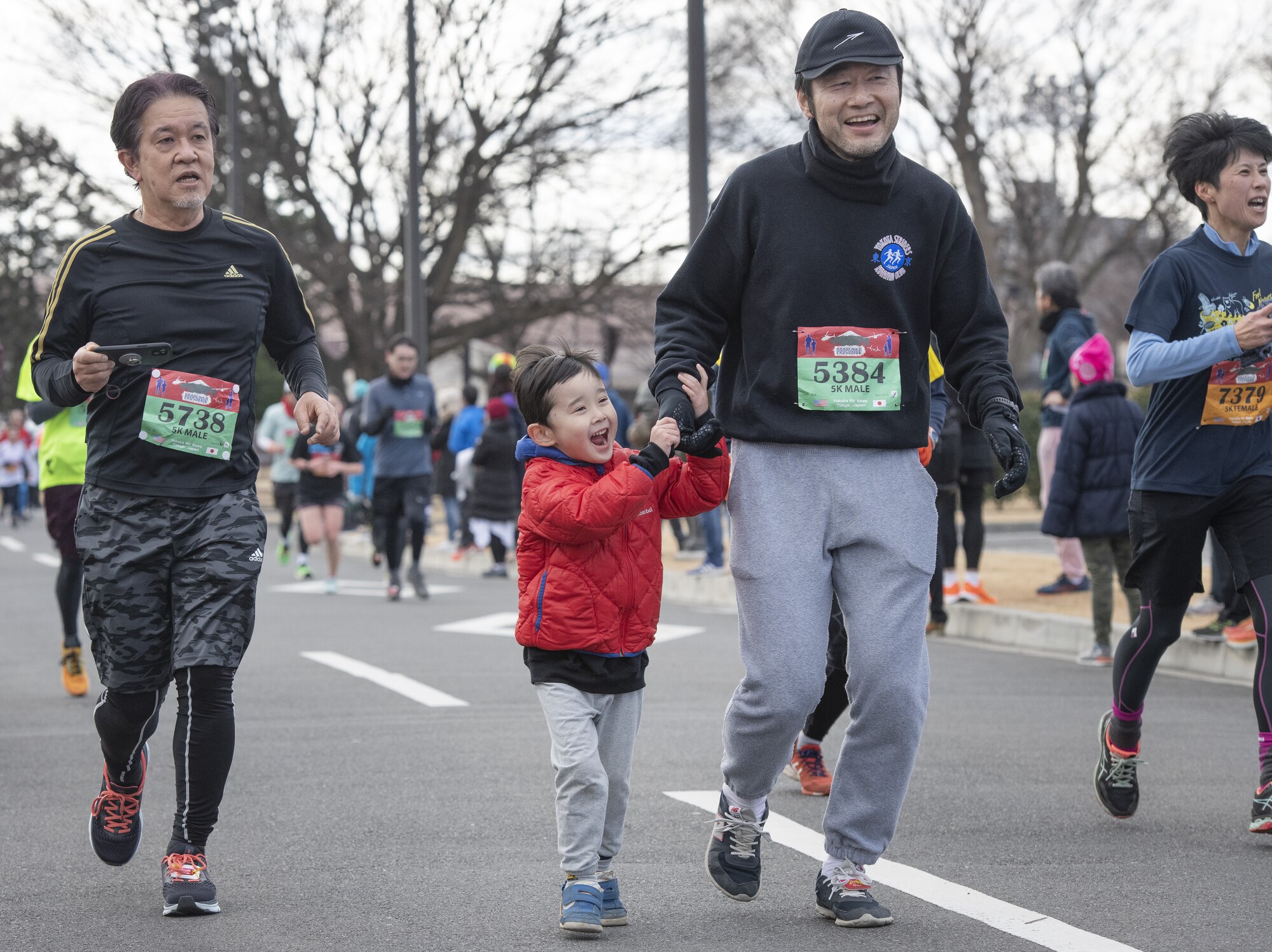 Runners participate in a 5-km run as part of the 42nd annual Frostbite Road Race.
