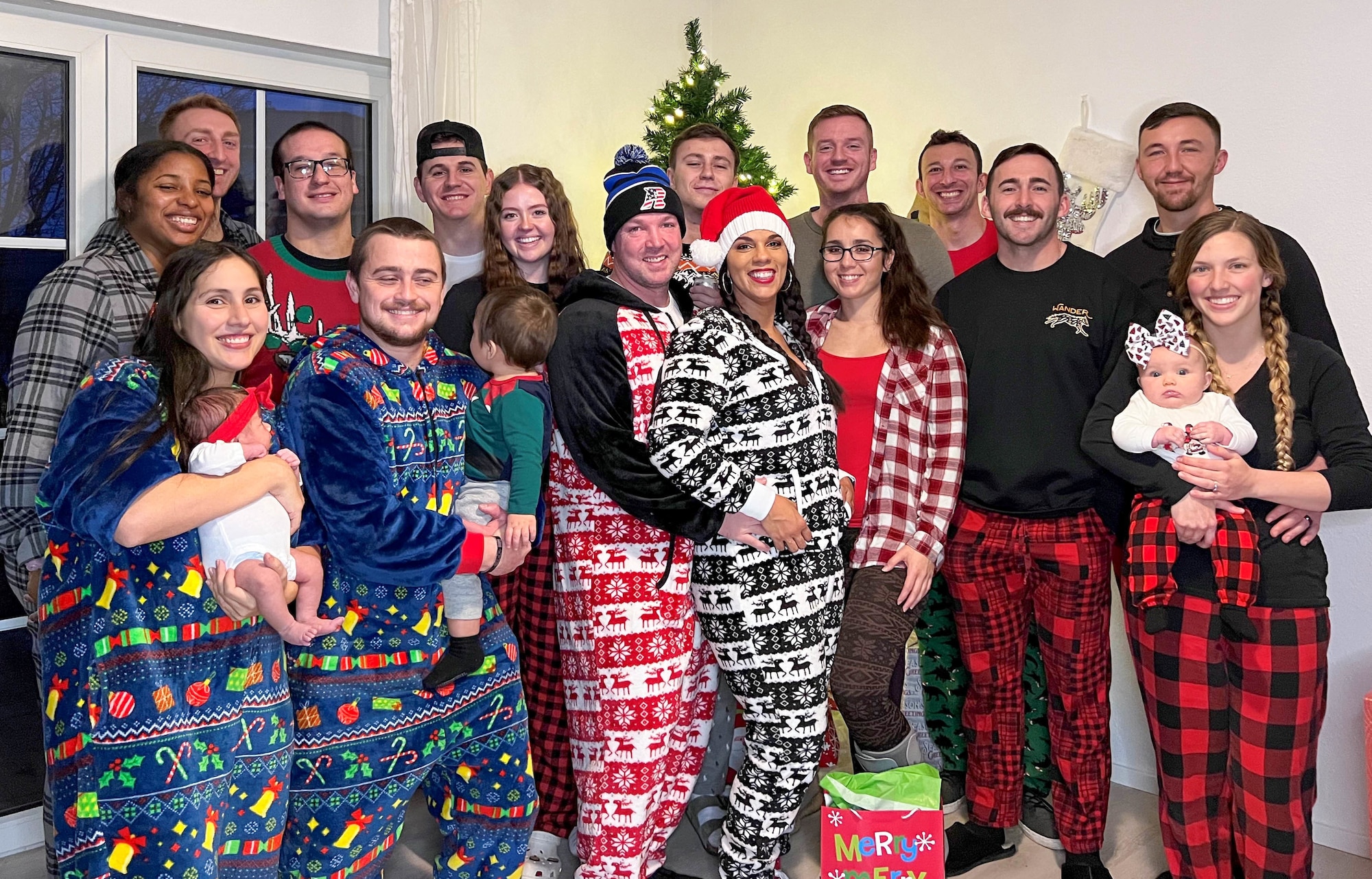 U.S. Air Force Airman 1st Class Jordan Lazaro, 86th Airlift Wing Public Affairs, public affairs apprentice, poses for a photo during a holiday gathering at Ramstein Air Base, Germany, Dec. 24, 2022.