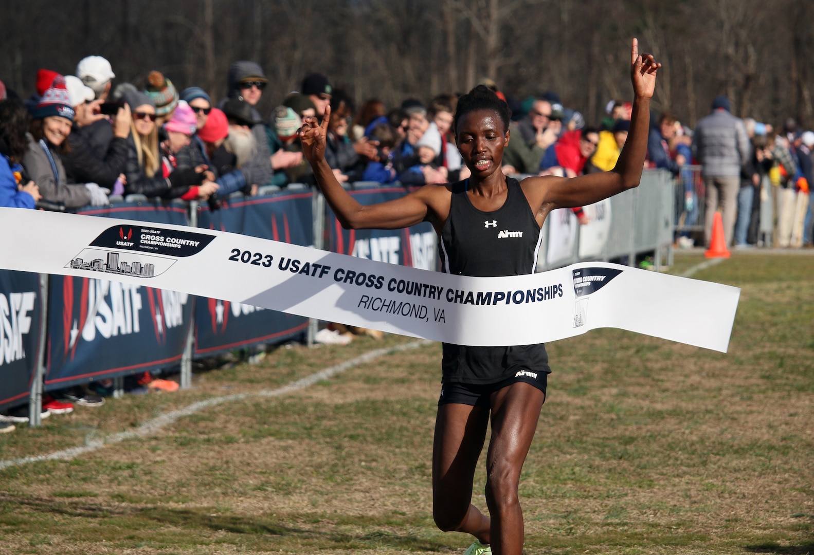 Army Sgt. Ednah Kurgat of Fort Carson, Colorado crosses the finish line to win the women's national championship during 2023 Armed Forces Cross Country Championship held in conjunction with the USA Track and Field Cross Country National Championship in Richmond, Va.  The Armed Forces Championship features teams from the Army, Marine Corps, Navy (with Coast Guard runners), and Air Force (with Space Force Runners).  Department of Defense Photo by Mr. Steven Dinote - Released.