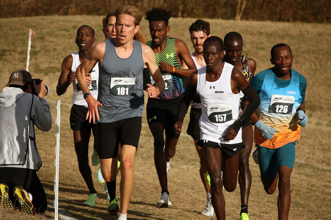 Army Staff Sgt. Leonard Korir (#157) of Fort Carson, Colorado leads the men's pack during the 2023 Armed Forces Cross Country Championship held in conjunction with the USA Track and Field Cross Country National Championship in Richmond, Va.  The Armed Forces Championship features teams from the Army, Marine Corps, Navy (with Coast Guard runners), and Air Force (with Space Force Runners).  Department of Defense Photo by Mr. Steven Dinote - Released.