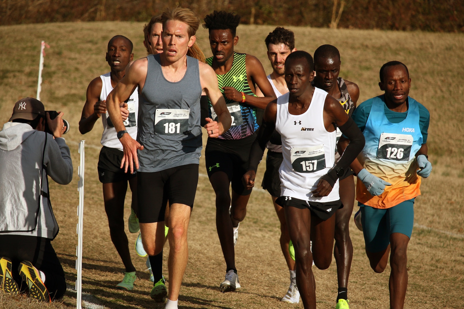 Army Staff Sgt. Leonard Korir (#157) of Fort Carson, Colorado leads the men's pack during the 2023 Armed Forces Cross Country Championship held in conjunction with the USA Track and Field Cross Country National Championship in Richmond, Va.  The Armed Forces Championship features teams from the Army, Marine Corps, Navy (with Coast Guard runners), and Air Force (with Space Force Runners).  Department of Defense Photo by Mr. Steven Dinote - Released.