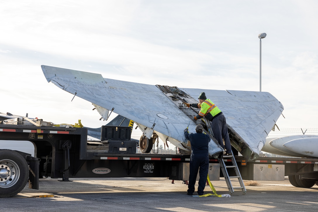 Fleet Readiness Center East (FRCE) contractors unload the wings of an A-4M Skyhawk on Marine Corps Air Station Cherry Point, North Carolina, Jan. 10, 2023.  The aircraft was assigned to Marine Attack Squadron-223 from May 1981 to Aug. 1987, where it logged more than 2,102 flight hours. Over the next couple of years, the aircraft will be restored by FRCE and placed in front of the air traffic control tower. (U.S. Marine Corps photo by Lance Cpl. Matthew Williams)