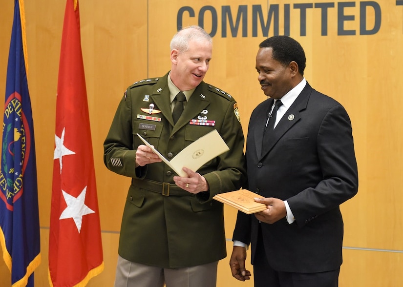 U.S. Army Lt. Gen. Scott D. Berrier, Defense Information Agency director, speaks with motivational speaker Dr. Stephon Ferguson at DIA's Martin Luther King Jr. Day observance Jan. 13, 2023, at Joint Base Anacostia-Bolling, Washington, D.C. The DIA hosted Ferguson, who travels throughout the nation delivering the powerful words of Dr. Martin Luther King Jr. to help reinvigorate King's dream through his voice. (Courtesy photo)