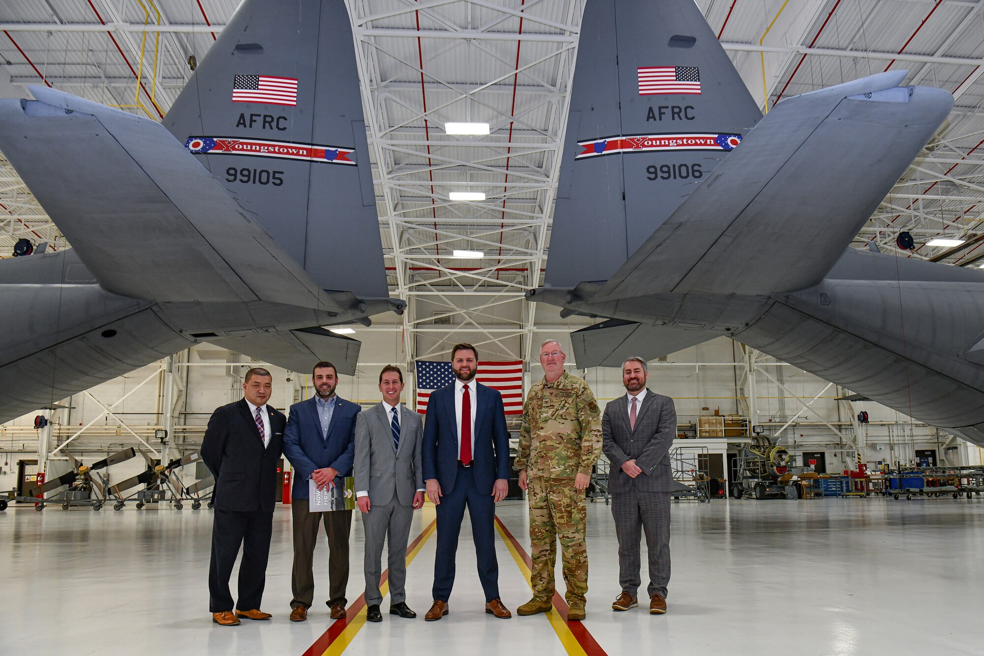 U.S. Sen. JD Vance, representing Ohio, Col. Jeff Van Dootingh, commander of the 910th Airlift Wing, and staff members pose for a photo on Jan. 17, 2023, at Youngstown Air Reserve Station, Ohio.