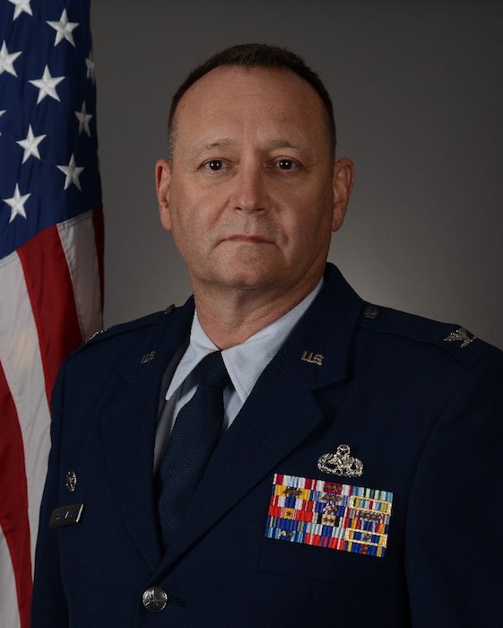 A U.S. Air Force Colonel poses for an official photo.