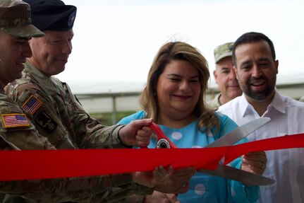 U.S. Army Reserve Brig. Gen. Eric Folkestad, Deputy Commanding General 81st Readiness Division cuts the ribbon during the official opening ceremony of the Aguadilla Army Reserve Center ribbon cutting ceremony, Jan. 22,2023 in Puerto Rico.