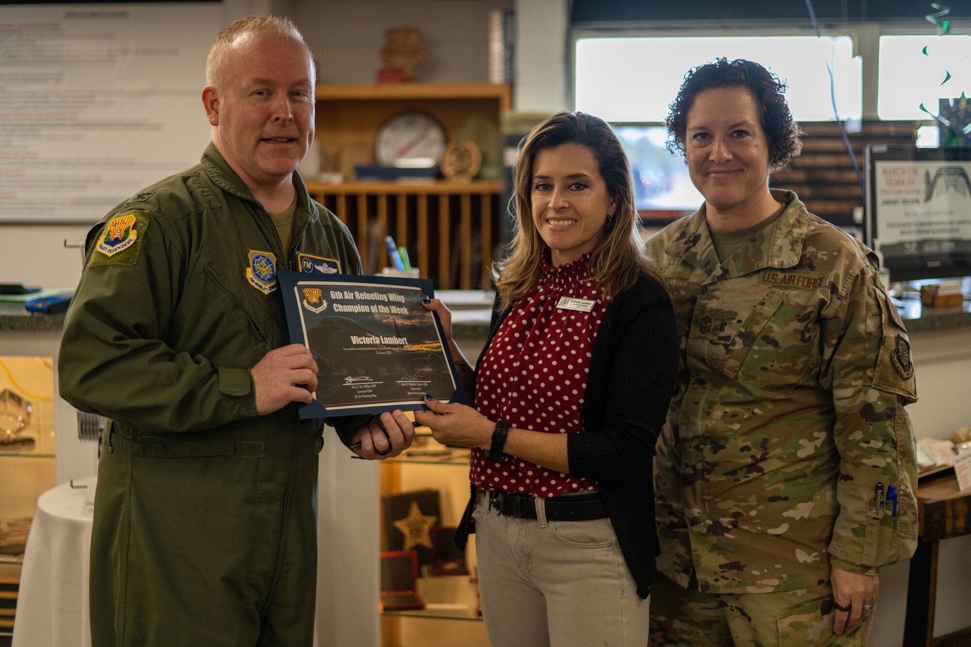 Lambert and her coworkers carried out a short-notice order during the holidays for a U.S. Special Operations command departing member. The hard work and dedication earned her the Champ of the Week recognition alongside two of her coworkers. (U.S. Air Force photo by Airman 1st Class Zachary Foster)
