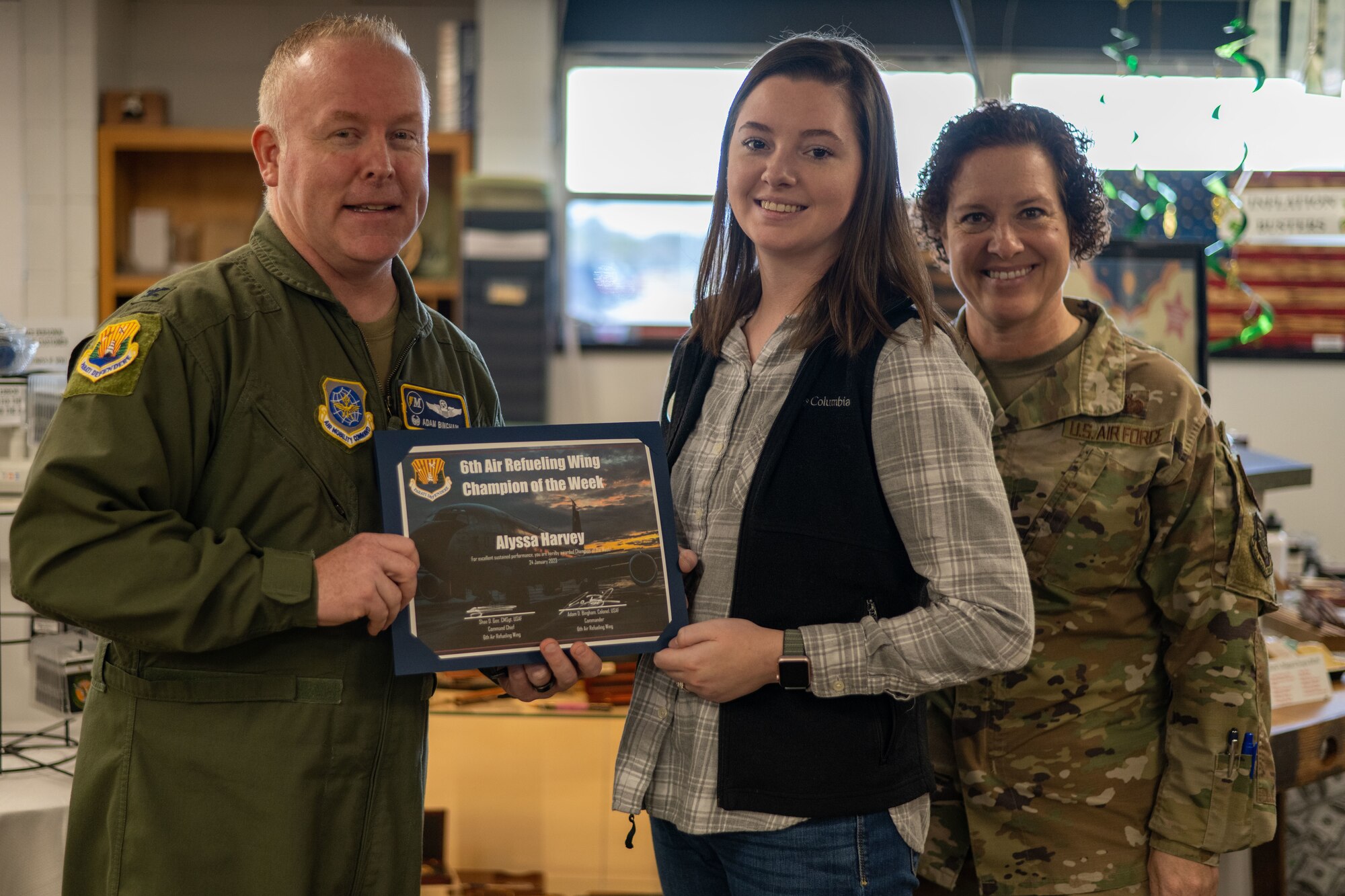 Harvey and her coworkers carried out a short-notice order during the holidays for a U.S. Special Operations command departing member. The hard work and dedication earned her the Champ of the Week recognition alongside two of her coworkers. (U.S. Air Force photo by Airman 1st Class Zachary Foster)