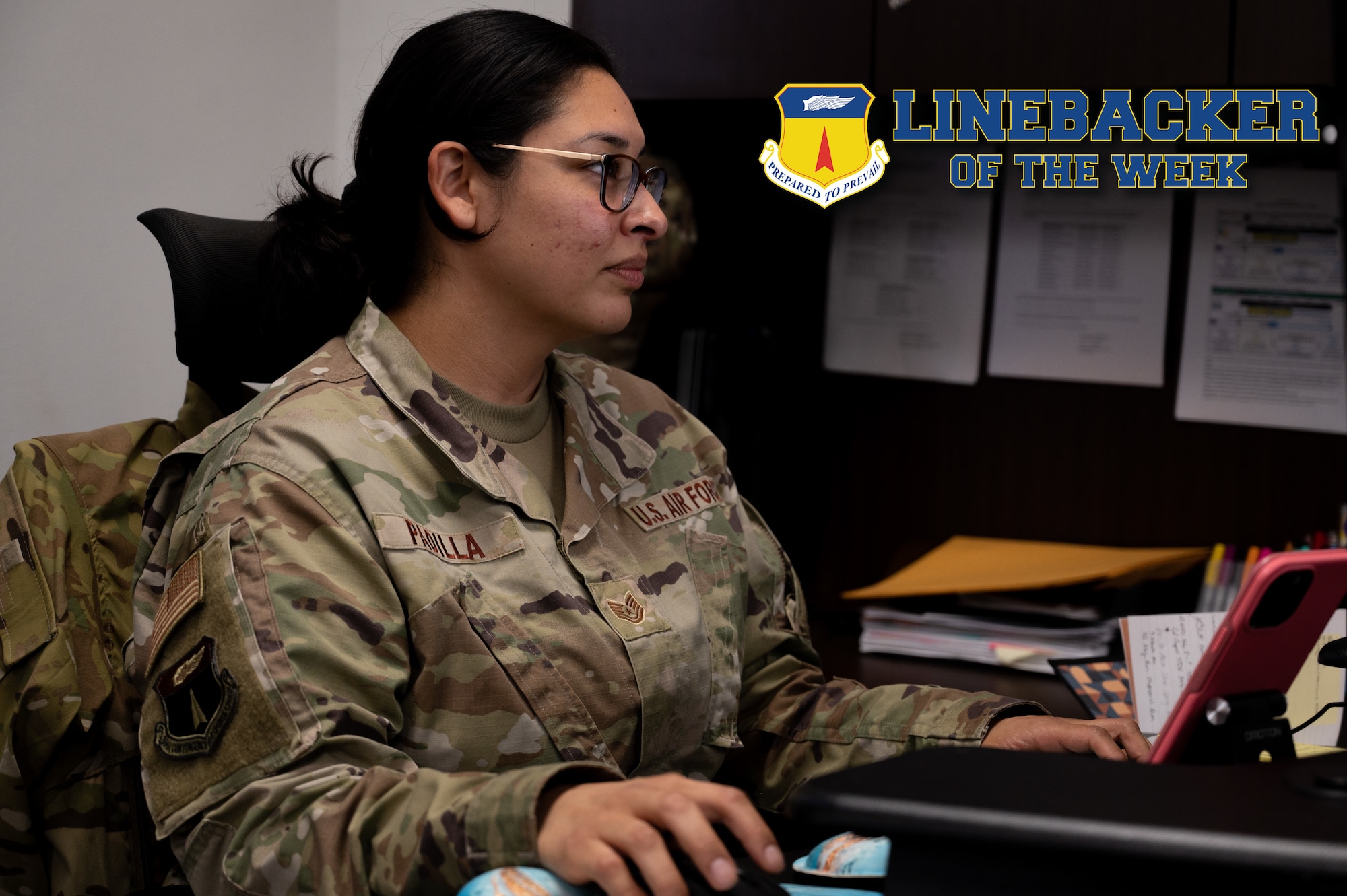 U.S. Air Force Tech. Sgt. Zarah Padilla, the commander’s executive assistant assigned to the 36th Contingency Response Group, works at her desk at Andersen Air Force Base, Guam, Jan. 18, 2023. The Team Andersen Linebacker of the Week recognizes outstanding enlisted, officer, civilian and total force personnel who have had an impact on achieving Team Andersen’s mission, vision and priorities. (U.S. Air Force photo illustration by Airman 1st Class Emily Saxton)