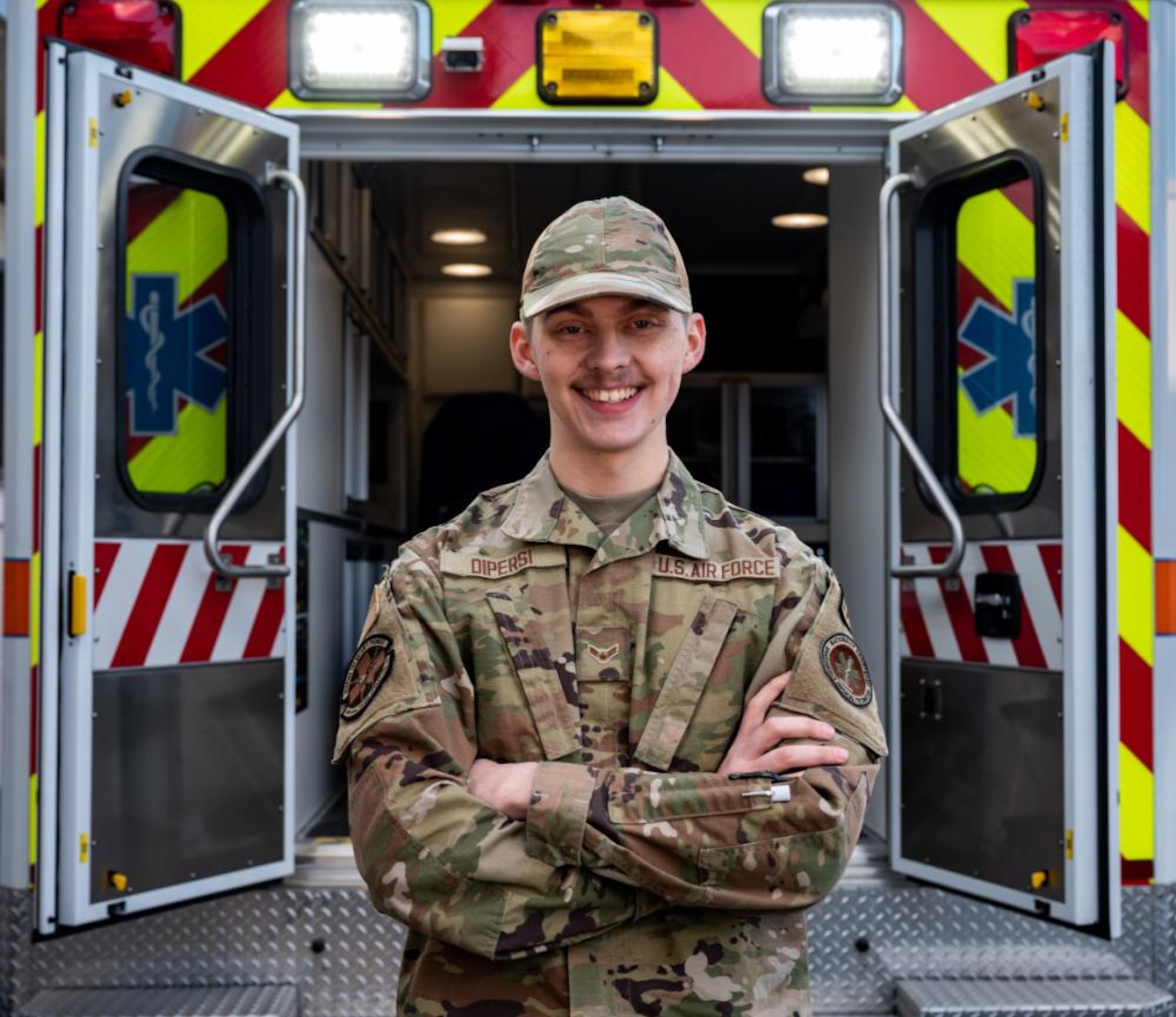 Airman 1st Class Bryan DiPersi, 436th Healthcare Operations Squadron ambulance response team member, poses for a photo at Dover Air Force Base, Delaware, Jan. 19, 2023. DiPersi used his emergency medical experience to provide care to a car crash victim off base. (U.S. Air Force photo by Airman 1st Class Amanda Jett)