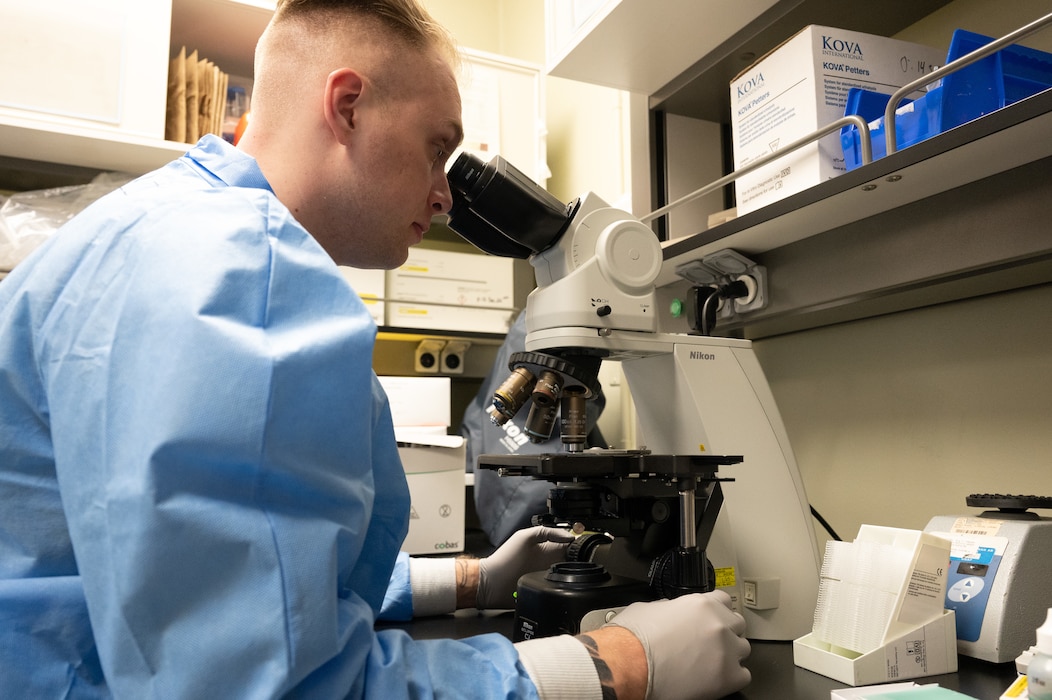 Senior Airman Michael Coughlin, 8th Healthcare Operations Squadron medical laboratory technician, looks at a sample at Kunsan Air Base, Republic of Korea, Jan. 18, 2023. Lab technicians can examine samples to identify any abnormalities in a patient. (U.S. Air Force photo by Staff Sgt. Sadie Colbert)