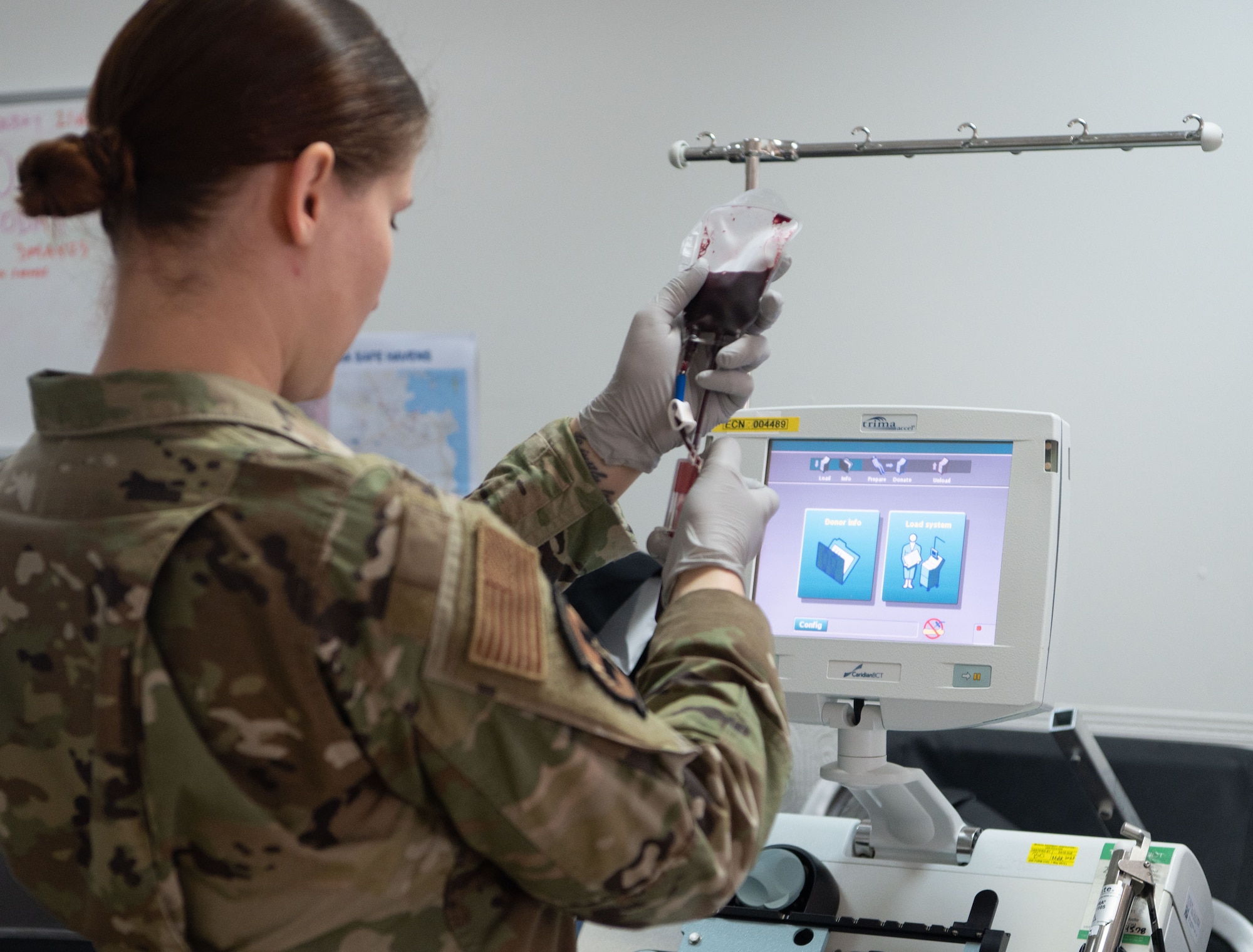 Photo of an airman holding a blood bag