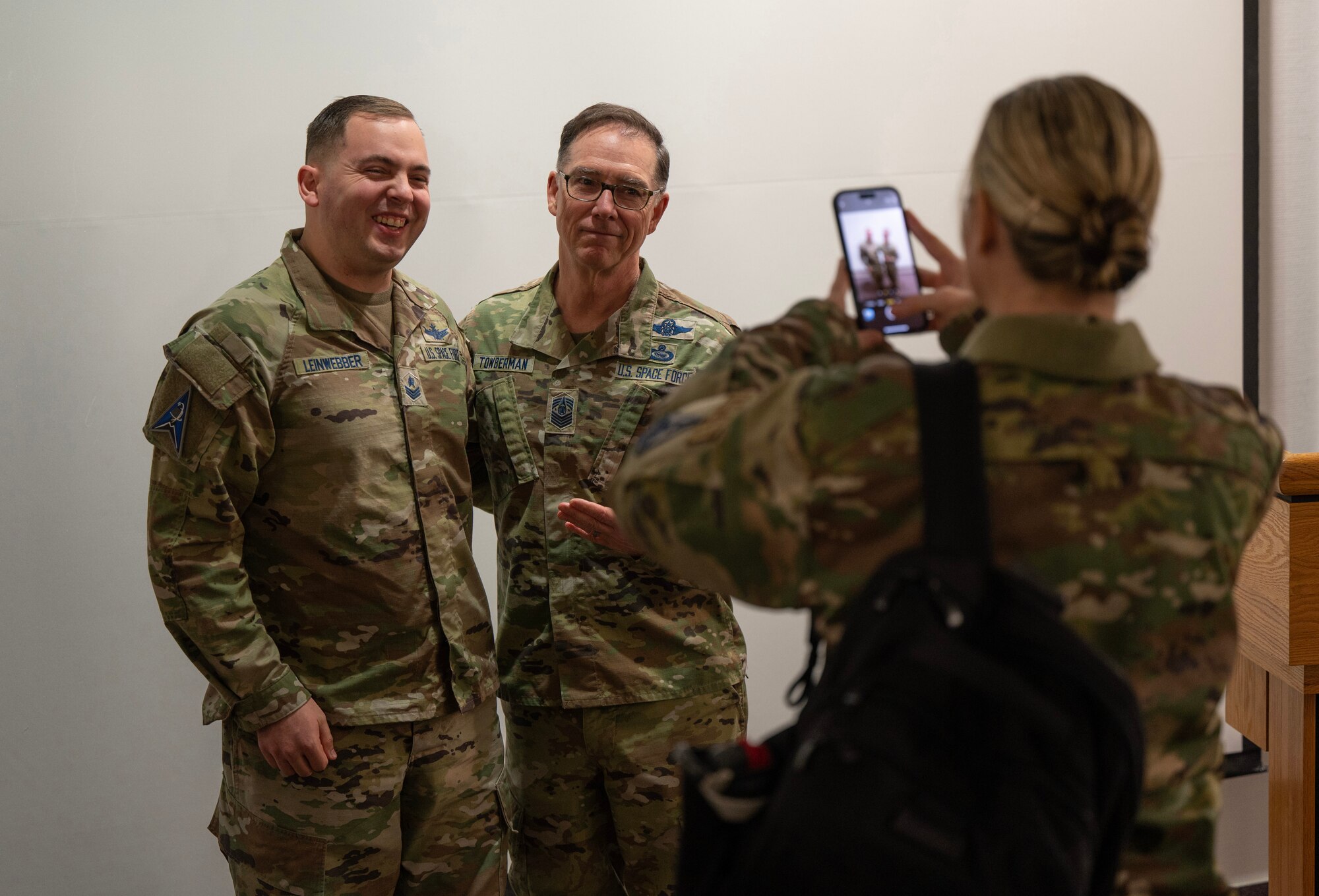 Chief Master Sergeant of the Space Force Roger A. Towberman poses for a photo with U.S. Space Force Sgt. Kendrick Leinwebber, after a town hall meeting