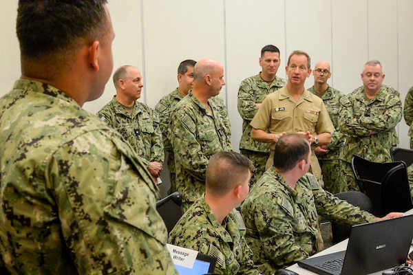 Vice Adm. John B. Mustin, chief of Navy Reserve and commander, Navy Reserve Force, talks to Reserve Sailors participating in MAKO Challenge at the Navy Warfare Development Center in Norfolk. The MAKO Challenge series provides the Navy Reserve an opportunity to enhance their skills and provide continued operational level war support in a realistic, challenging, and dynamically responsive environment.