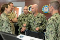 Vice Adm. James Kilby, center, deputy commander, U.S. Fleet Forces Command, talks to Reserve Sailors participating in MAKO Challenge at the Navy Warfare Development Center in Norfolk. The MAKO Challenge series provides the Navy Reserve an opportunity to enhance their skills and provide continued operational level war support in a realistic, challenging, and dynamically responsive environment.