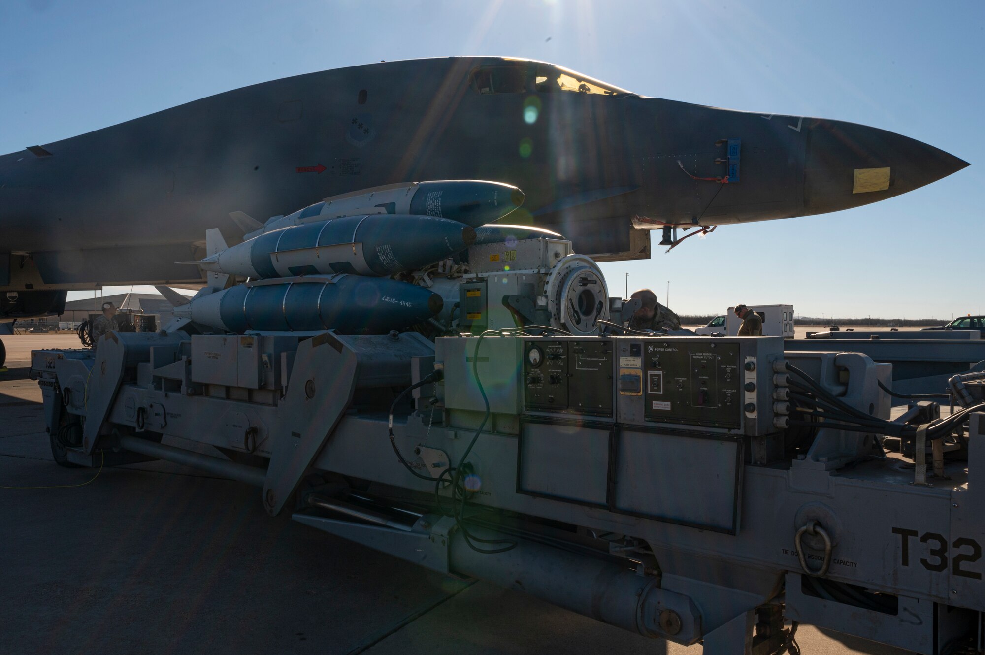 The Launcher Load Frame sits outside of a B-1 B Lancer prior to loading at Dyess Air Force Base, Texas, Jan. 9, 2023. After the B-1 was deemed no longer nuclear certified, the pre-load capability went unused for 30 years until now. The LLF is a piece of equipment that allows Weapons Loaders to pre-load munitions on a launcher, under the cover of a facility, prior to transporting the entire launcher/munition package to the flight-line for loading on the aircraft.

(U.S. Air Force photo by Senior Airman Josiah Brown)