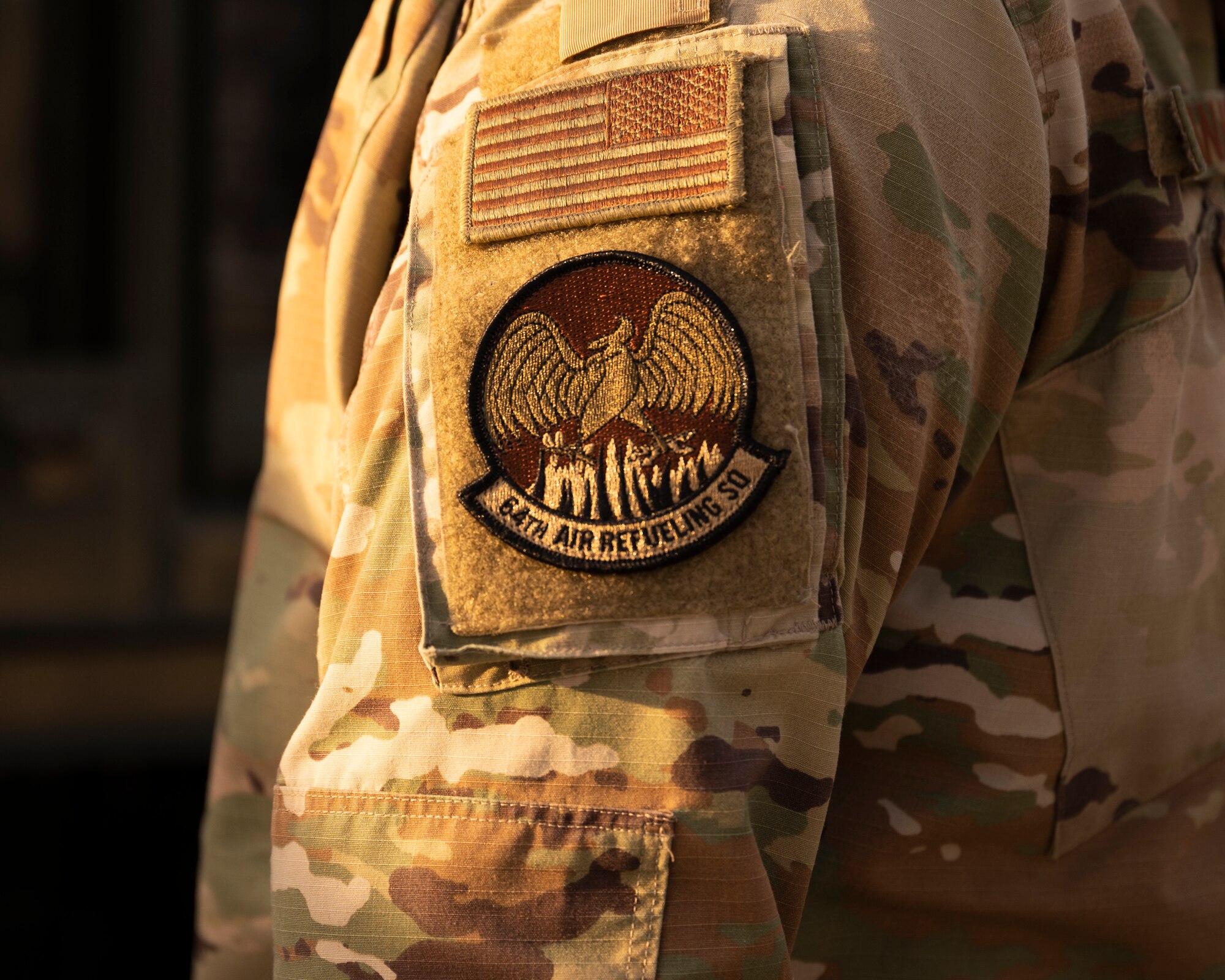 The sun rise hits a 64th ARS patch.
