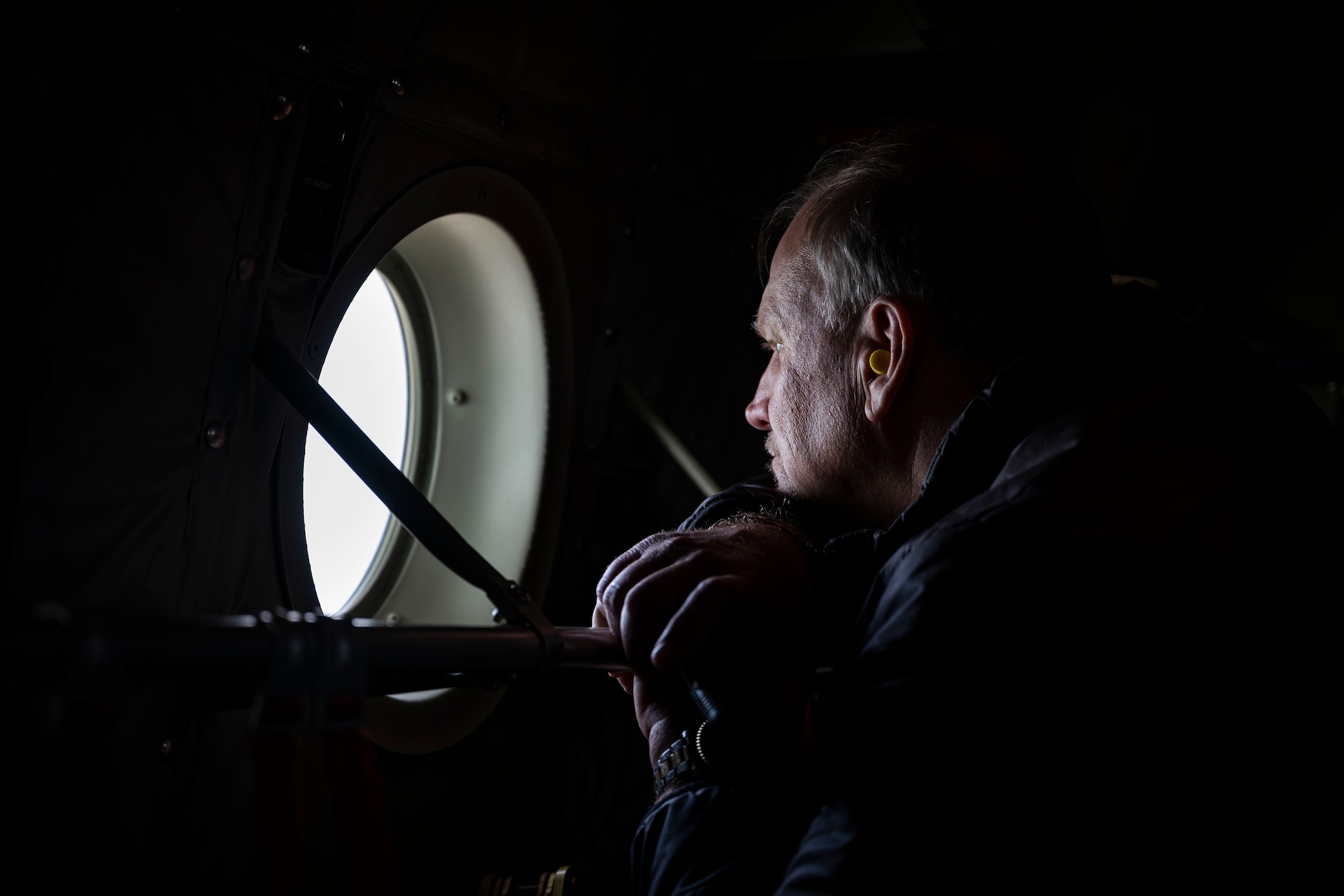 An honorary commander inductee looks out the window of a C-130J Super Hercules during an honorary commander induction tour incentive flight at Dyess Air Force Base, Texas, Jan. 20, 2023. Civic leaders and community leaders selected as honorary commanders will serve a two-year term. At the end of their term, the program’s goal is to have forged a mutually beneficial relationship between influential community members and Dyess Airmen and their families that last beyond their term as honorary commanders. (U.S. Air Force photo by Senior Airman Leon Redfern)