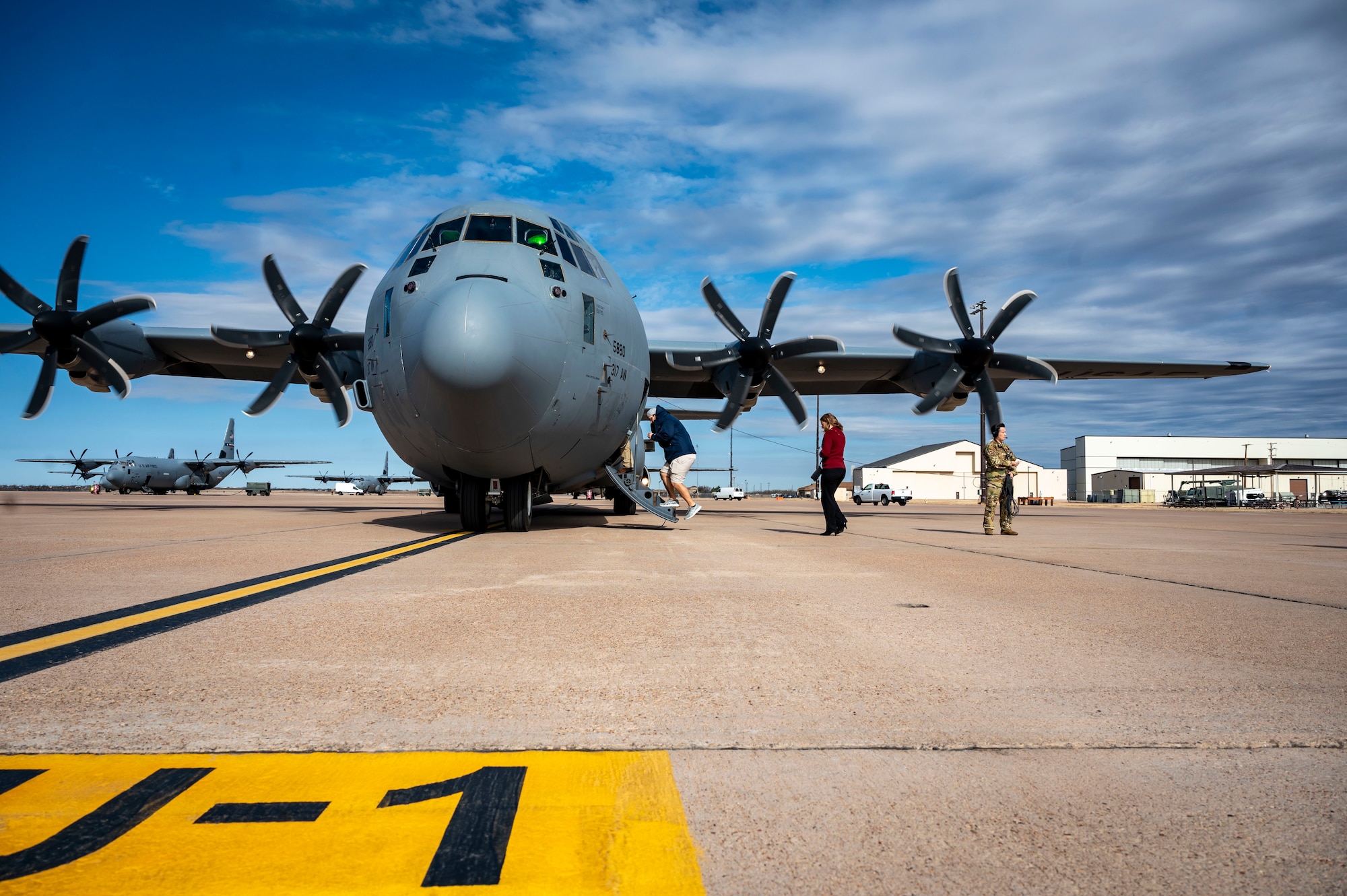 A group of honorary commander inductees board a C-130J Super Hercules during an honorary commander induction tour incentive flight at Dyess Air Force Base, Texas, Jan. 20, 2023. The program also serves as a forum in which Dyess commanders can solicit advice and support from their civic leader counterparts on matters affecting military and civilian communities. Honorary commanders will be assigned to unit commanders serving in the 7th Bomb Wing, 317th Airlift Wing, 489th Bomb Group, 436th Training Squadron, 337th Test Evaluation Squadron, 77th Weapons Squadron and Det. 1 U.S. Marine Corps. (U.S. Air Force photo by Senior Airman Leon Redfern)