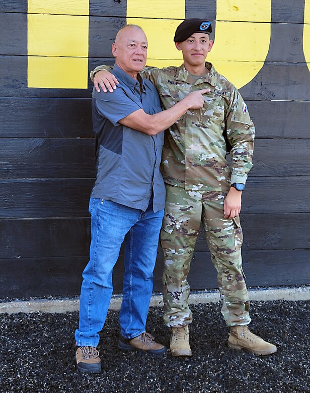 U.S. Army Spc. Jason Riley stands with his father, retired Command Sgt. Maj. Kenneth Riley, after the pinning ceremony to celebrate his graduation Nov. 3, 2022, from The Sabalauski Air Assault School, Fort Campbell, Kentucky. Riley is a biomedical equipment specialist assigned to the U.S. Army Medical Materiel Center-Europe. (U.S. Army photo courtesy Spc. Jason Riley)