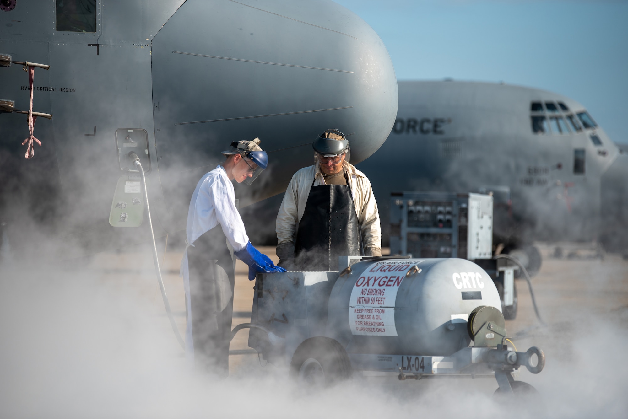 Airmen service the liquid oxygen system on a C-130J Super Hercules at the Gulfport Combat Readiness Training Center in Gulfport, Miss., Aug. 14, 2022, as part of Maintenance University. More than 300 Air Guardsmen from Kentucky, Texas, West Virginia, Rhode Island and California trained on career-specific proficiencies during the intensive week-long course. (U.S Air National Guard photo by Phil Speck)