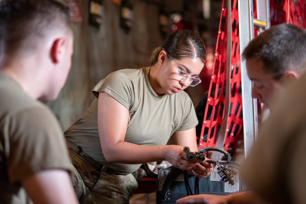 Airman 1st Class Geovannah Vazquez, a crew chief with the Rhode Island Air National Guard’s 143rd Aircraft Maintenance Squadron, prepares to set up a vibration analyzer on a C-130J Super Hercules at the Gulfport Combat Readiness Training Center in Gulfport, Miss., Aug. 15, 2022, as part of Maintenance University. More than 300 Air Guardsmen from Kentucky, Texas, West Virginia, Rhode Island and California trained on career-specific proficiencies during the intensive week-long course. (U.S Air National Guard photo by Phil Speck)