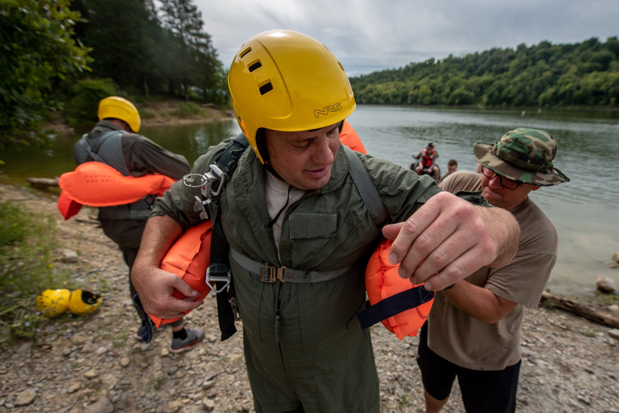 Maj. Andrew Hutchinson, a pilot for the Kentucky Air National Guard’s 165th Airlift Squadron, is donned with a parachute harness in preparation for a parachute drag during water survival training at Taylorsville Lake in Spencer County, Ky., Sept. 10, 2022. The annual training refreshes aircrew members on skills learned during U.S. Air Force Survival School. (U.S. Air National Guard photo by Tech. Sgt. Joshua Horton)