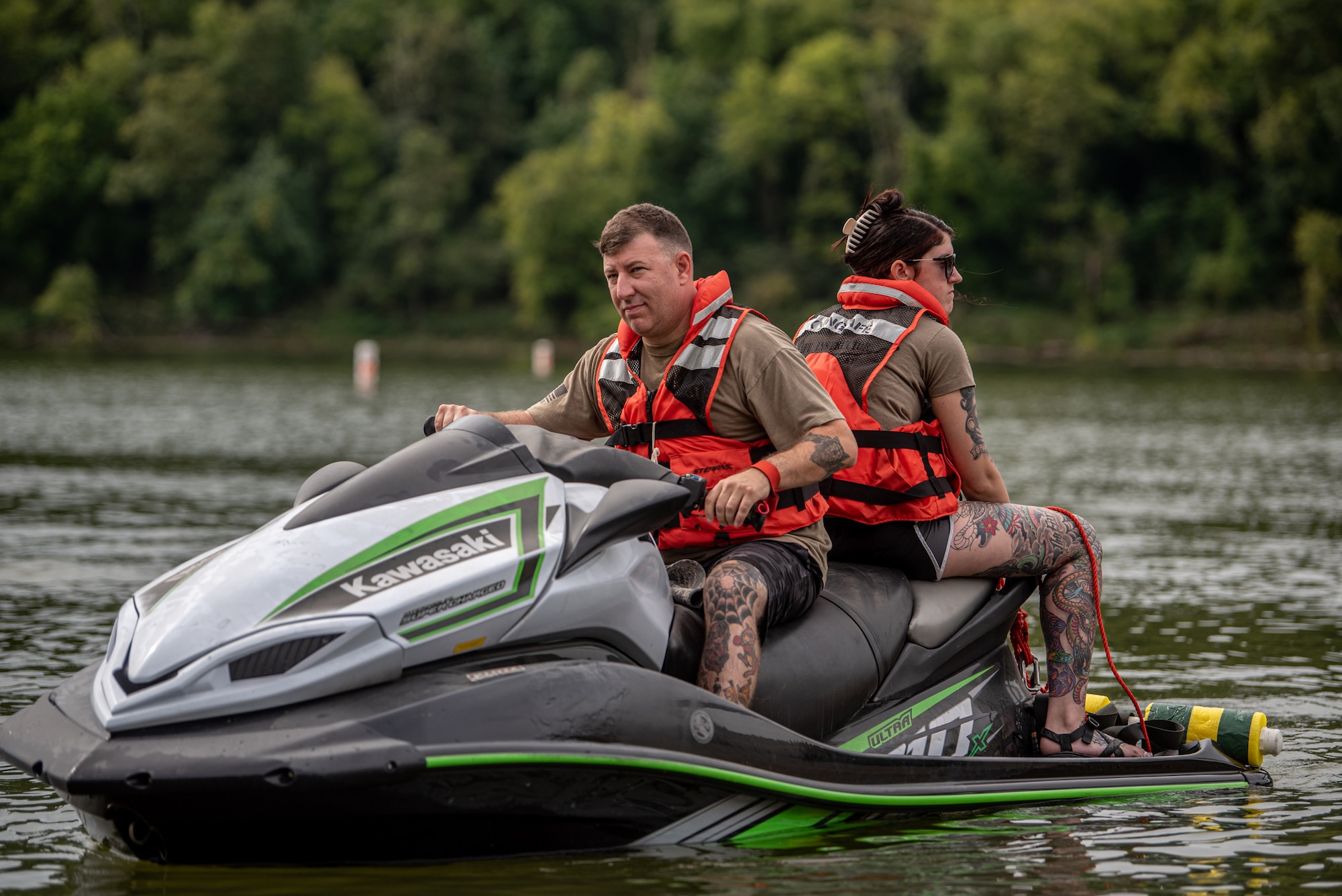 Aircrew flight equipment specialists from the Kentucky Air National Guard’s 123rd Operations Group prepare to simulate parachute drag with a Jet Ski during water survival training at Taylorsville Lake in Spencer County, Ky., Sept. 10, 2022. The annual training refreshes aircrew members on skills learned during U.S. Air Force Survival School. (U.S. Air National Guard photo by Tech. Sgt. Joshua Horton)