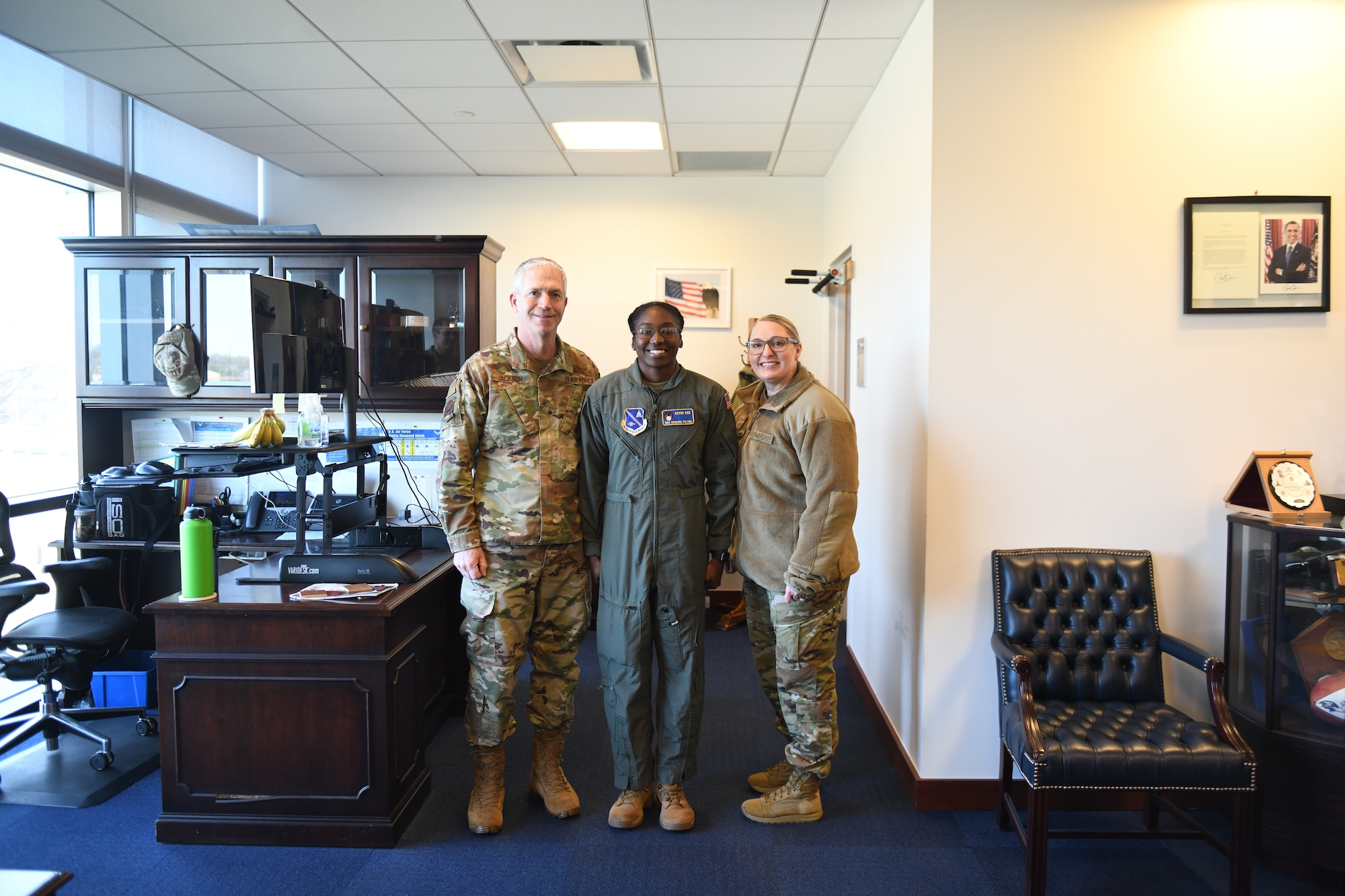 Major General Joel Jackson, Air Force District of Washington commander, and Chief Master Sergeant Chassidy Sells, AFDW command first sergeant , meets with Senior Airman Kimarri Fulton, raven with the 316th Wing to recognize her for her outstanding performance within her career field Jan. 24, 2023, Joint Base Andrews.