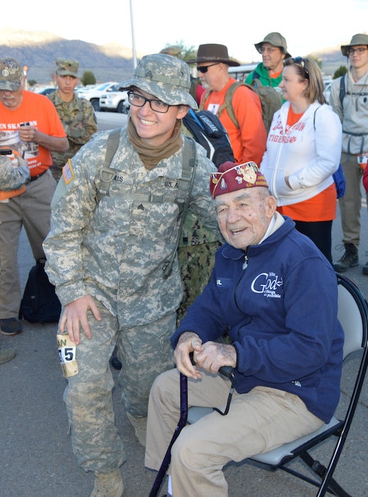 U.S. Army Reserve Sgt. Zachary Mills, a petroleum supply specialist with the 372nd Quartermaster Battalion stationed at Kirtland Air Force Base, N.M., poses for a picture with retired U.S. Air Force and Army Air Corps Chief Master Sgt. Paul Kerchum, a survivor of the original Bataan Death March, at White Sands Missile Range, N.M., March 25, 2018. Kerchum spent three and a half years as a prisoner of the Japanese Army during World War II. (U.S. Army photo by Capt. Tom Piernicky)