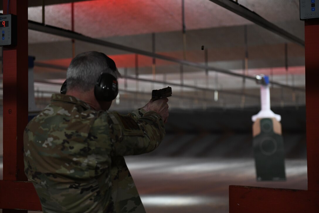 Maj. Gen. Joel Jackson, Air Force District of Washington commander, fires an M18 pistol during his immersion with Combat Arms Training and Maintenance at Joint Base Andrews, Md., Jan. 24, 2023.