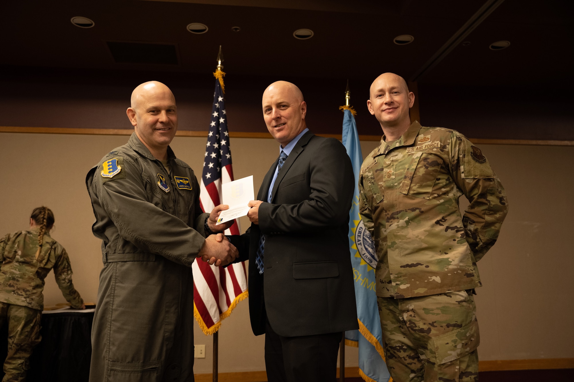 More than 100 area civic and business leaders joined Airmen from Ellsworth Air Force Base, S.D., to recognize individuals completing their terms in the Ellsworth Honorary Commanders Program and welcome 11 new inductees during a special luncheon at The Monument in Rapid City, S.D., Jan. 18. The 28th Bomb Wing commander selects who participates in the program and which Ellsworth unit they will be assigned to for a two-year term. Currently there are 26 area civic and business leaders enrolled in the program.(U.S. Air Force photo by Senior Airman Austin McIntosh)