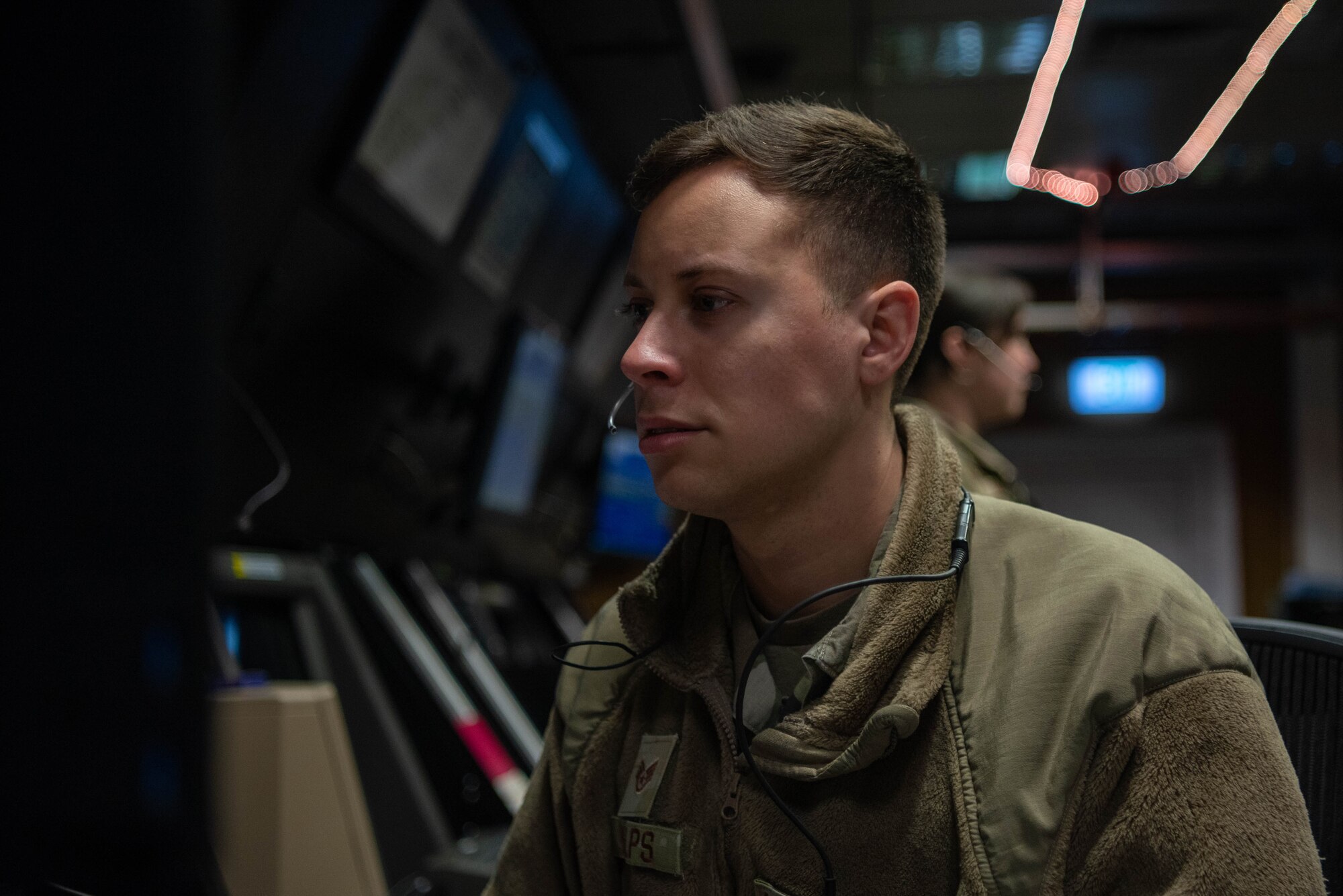 Service member at his desk.