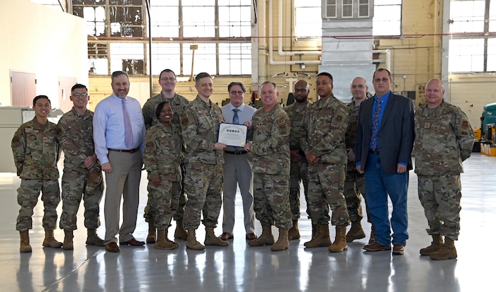 Members fro the 908th Airlift Wing, Community college of the Air Force and the Federal Aviation Administration pose for a photo, Jan. 20, 2023, before a briefing on the new FAA Airframe and Powerplant certification program developed at Maxwell Air Force Base, Ala. 
(U.S. Air Force photo/Brian Ferguson)