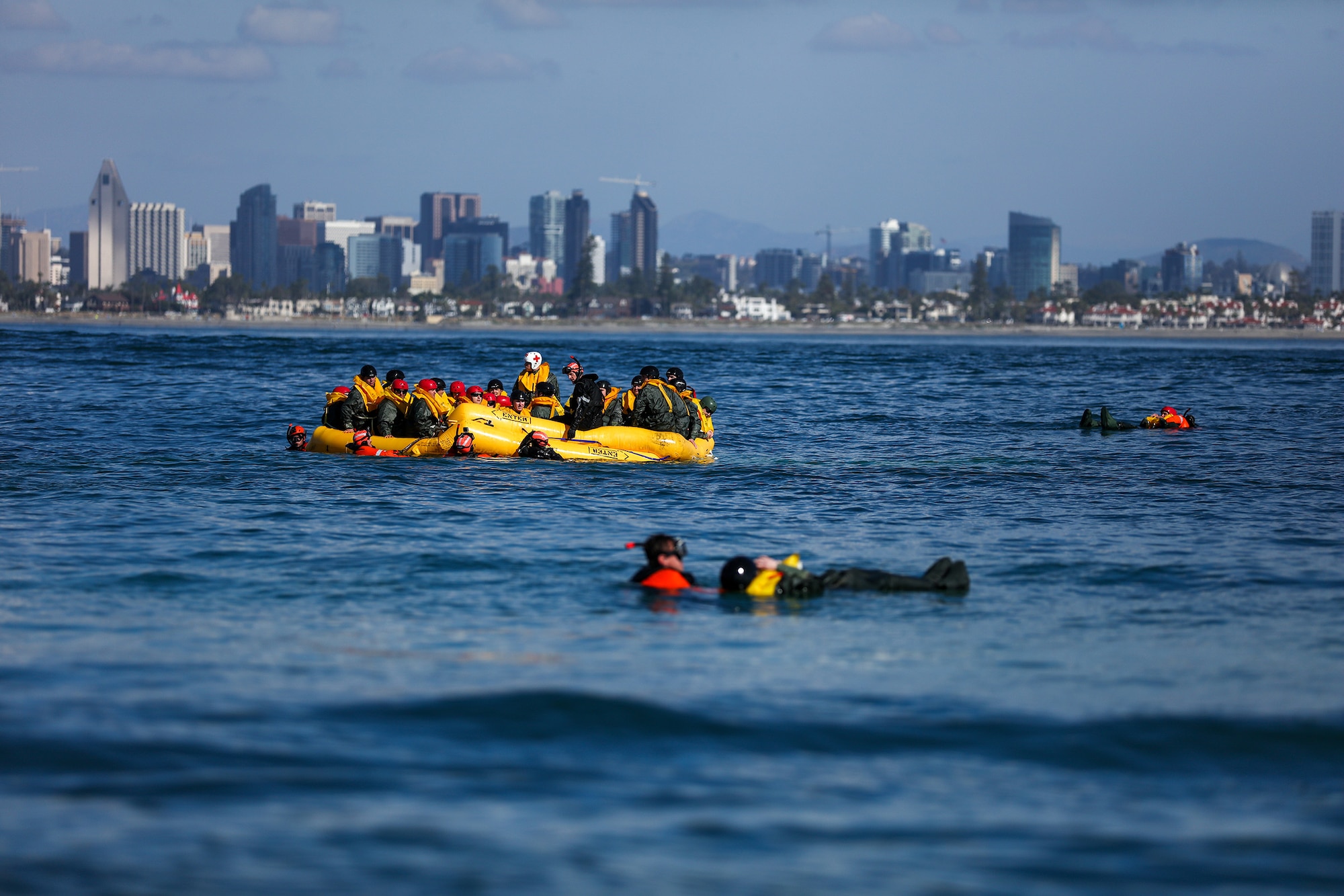 Reserve Citizen Airmen assigned to the 445th Operations Group participate in survival, evasion, resistance and escape (SERE) training aboard a 46-man life raft during water survival training held off the coast of San Diego, California Jan. 19, 2023. The training event was a joint effort between the 445th Airlift Wing and the Helicopter Sea Combat (HSC)-3, HSC-8, HSC-23 and Coast Guard Sector San Diego. Over 150 Reservists from the 445th Airlift Wing, to include 445th Aeromedical Evacuation Squadron, 445th Aerospace Medicine Squadron, 445th Operations Support Squadron, 445th Maintenance Group, 445th Aircraft Maintenance Squadron, 445th Maintenance Squadron, 87th Aerial Port Squadron and 89th Airlift Wing provided support or participated in the training event that included water survival, AES training flights and urban survival, evasion, resistance and escape.