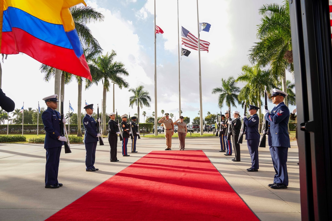 U.S. Army Gen. Laura Richardson, commander of U.S. Southern Command, and the General Commander of the Colombian Military Forces, Gen. Helder Giraldo, stand at the entrance to the command's headquarters.