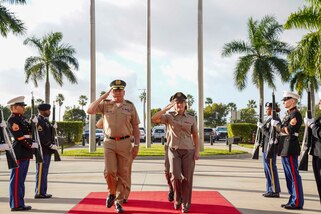 U.S. Army Gen. Laura Richardson, commander of U.S. Southern Command, and the General Commander of the Colombian Military Forces, Gen. Helder Giraldo, walk to the entrance to the command's headquarters.