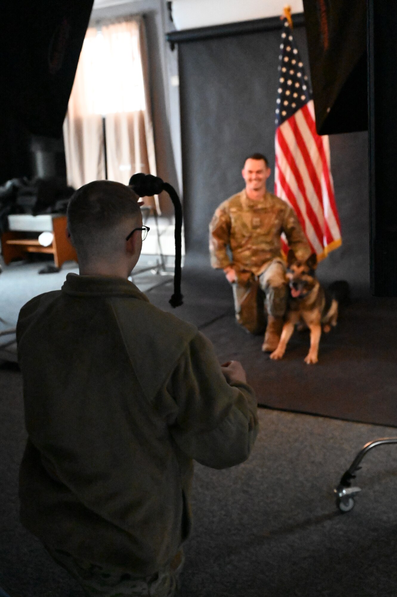 military working day getting an official photo taken with his handler