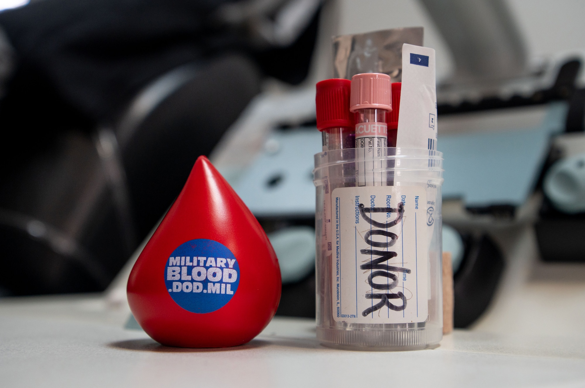 Photo of a stress ball and blood collecting equipment