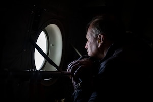 An honorary commander inductee looks out the window of a C-130J Super Hercules during an honorary commander induction tour incentive flight at Dyess Air Force Base, Texas, Jan. 20, 2023. Civic leaders and community leaders selected as honorary commanders will serve a two-year term. At the end of their term, the program’s goal is to have forged a mutually beneficial relationship between influential community members and Dyess Airmen and their families that last beyond their term as honorary commanders. (U.S. Air Force photo by Senior Airman Leon Redfern)