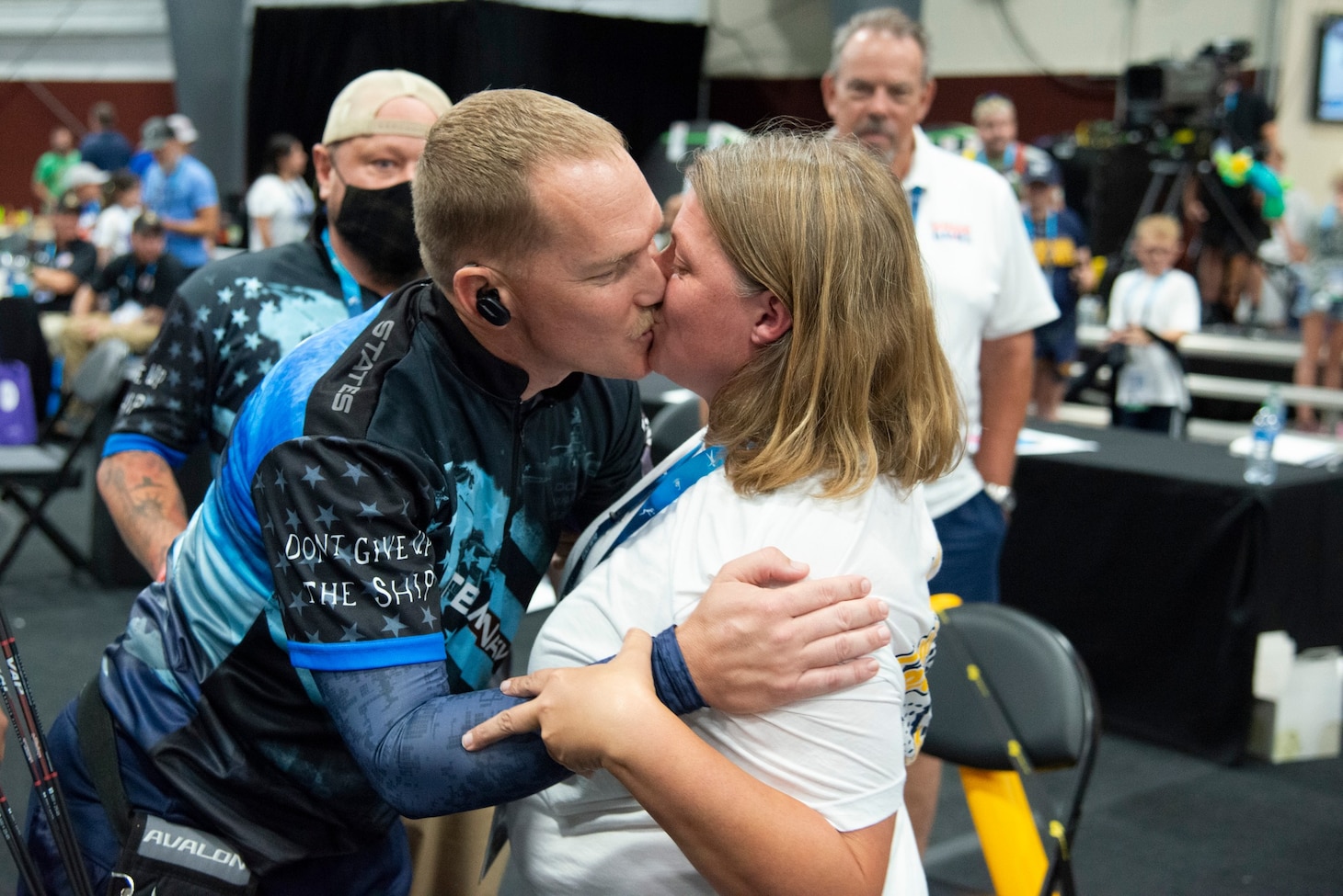 Operations Specialist 1st Class Travis Wyatt and his wife, Teea Wyatt, share a kiss during OS1 Wyatt’s participation in the 2022 Warrior Games in an undated photo.