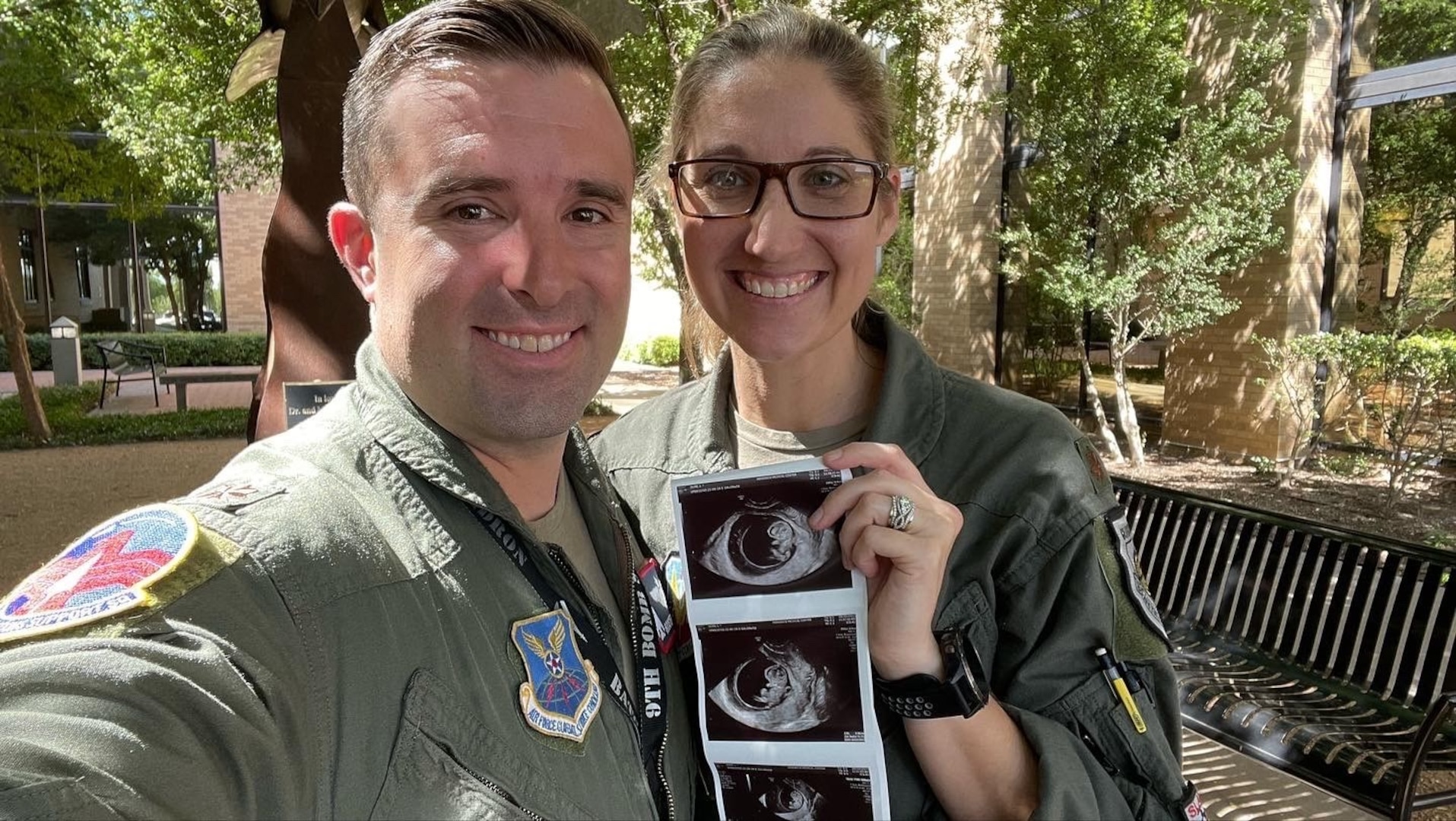 U.S. Air Force Maj. Lauren Olme, 77th Weapons Squadron assistant director of operations, and her husband, Maj. Mark Olme, 7th Operations Support Squadron bomb wing weapons officer, pose with an ultrasound photo of their child at Dyess Air Force Base, Texas, Jan. 24, 2023. Lauren, who is currently pregnant, can continue flying after recently getting approved under the Air Force’s new guidance which allows female aircrew members to voluntarily request to fly during pregnancy. No waiver is required to fly in the second trimester with an uncomplicated pregnancy in a non-ejection seat aircraft if all flight safety criteria are met. All pregnant aircrew members are also authorized to apply for a waiver regardless of trimester, aircraft or flight profile. (Courtesy photo)
