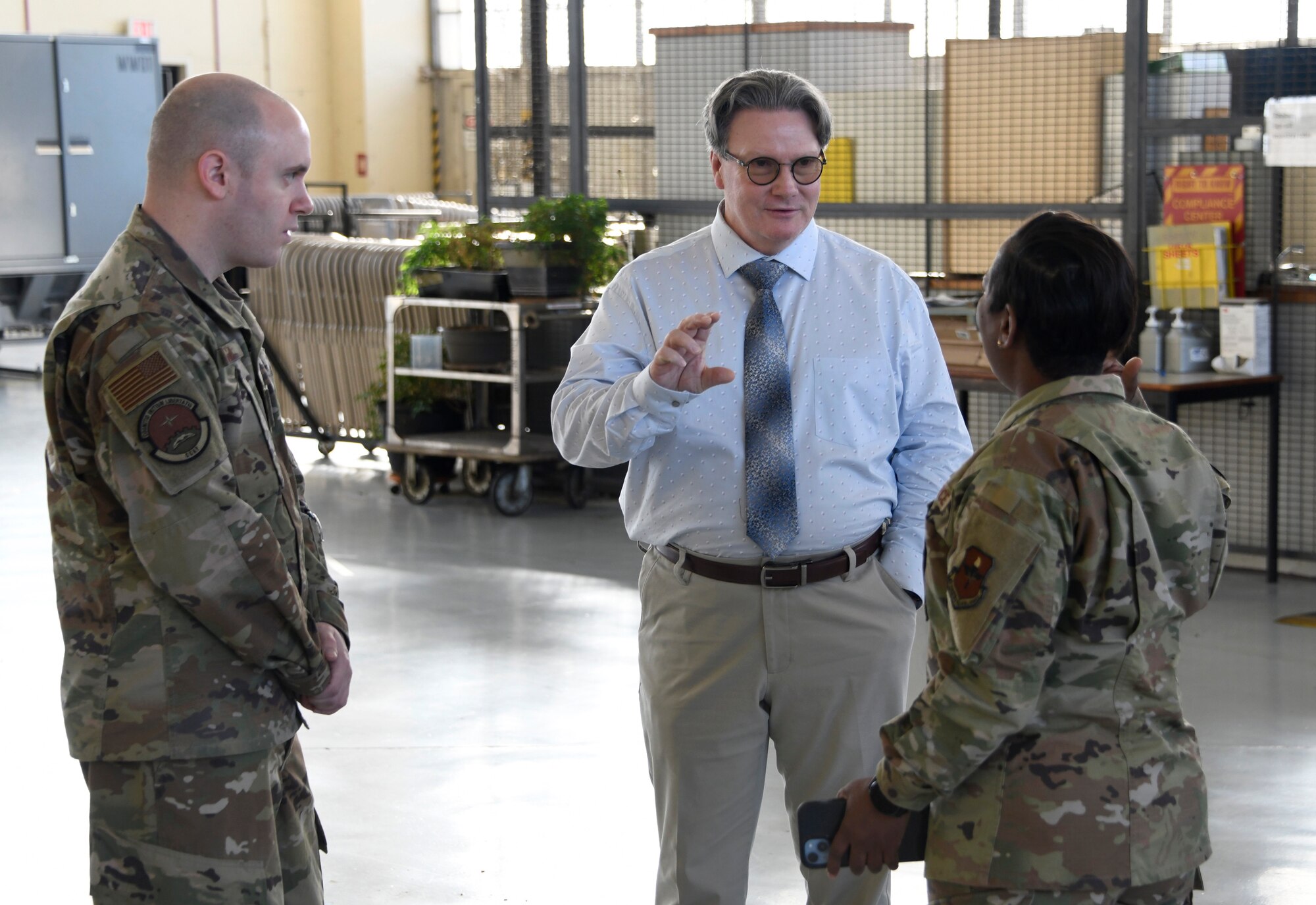 Left, Tech. Sgt. Brian Haga, 908th Maintenance Group, Chief Master Sgt. Alexius Reid, Community College of the Air Force, and Bryan Davis, Federal Aviation Administration, discuss the new FAA Airframe and Powerplant certification program developed at Maxwell Air Force Base, Ala., Jan 20, 2023. 
(U.S. Air Force photo/Brian Ferguson)