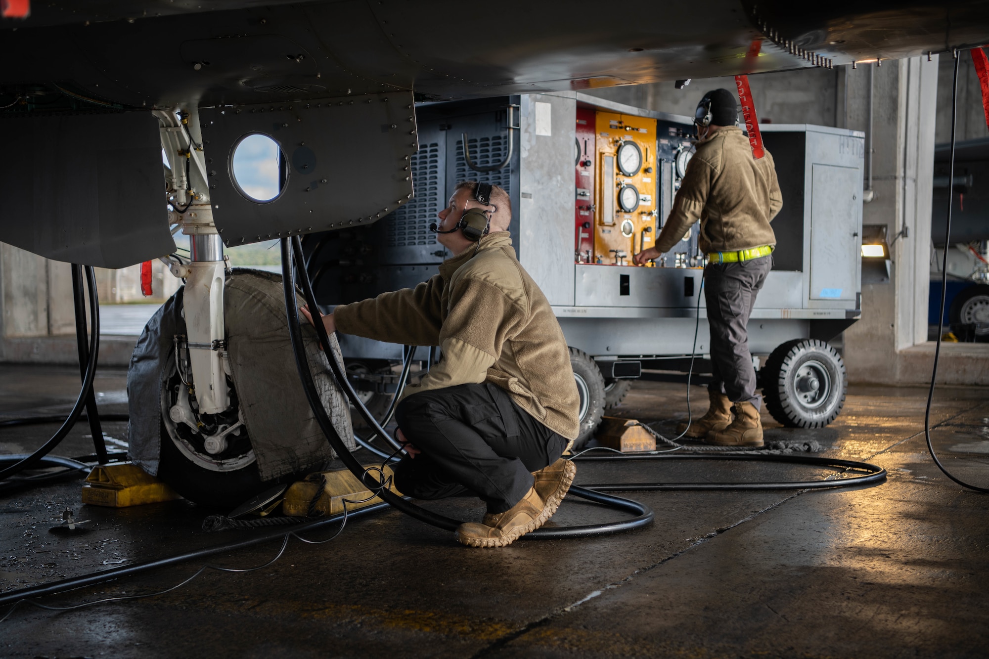 Airmen conducts aircraft maintenance.