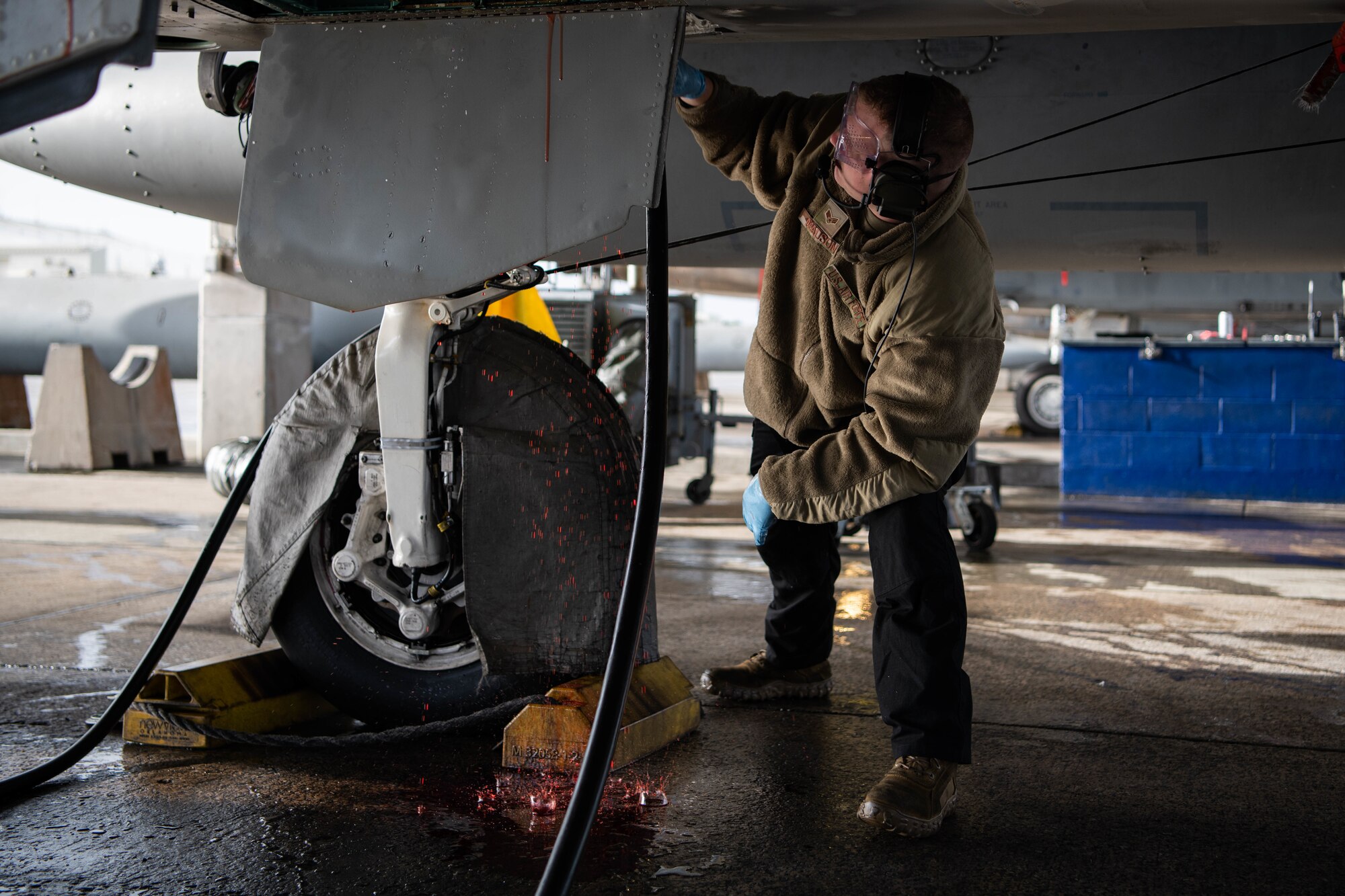 An Airman conducts aircraft maintenance.