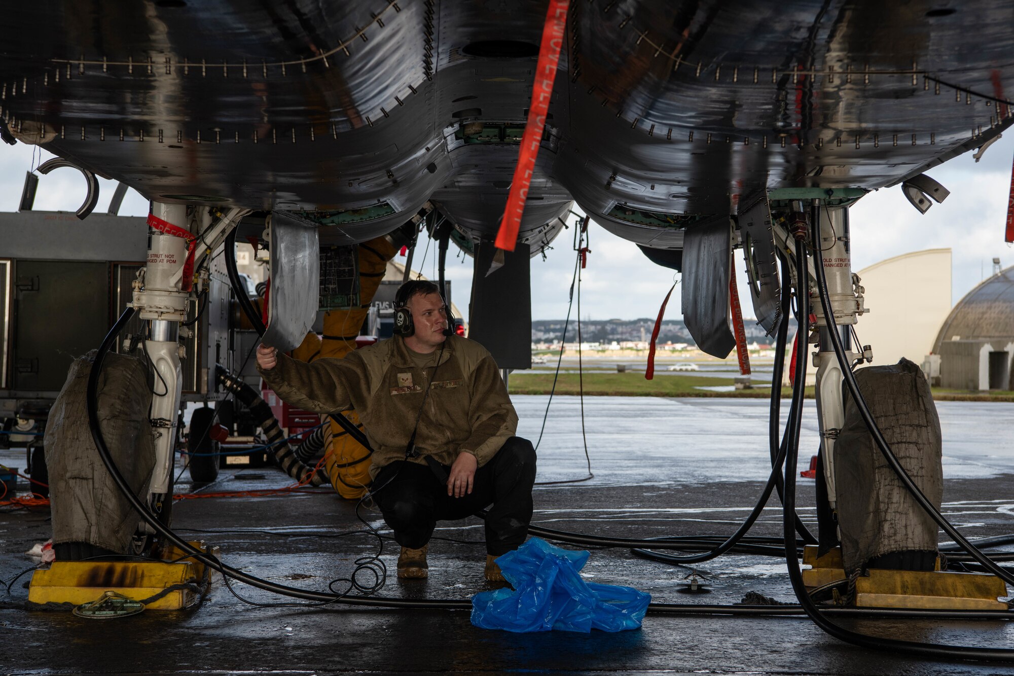 An Airman conducts aircraft maintenance.